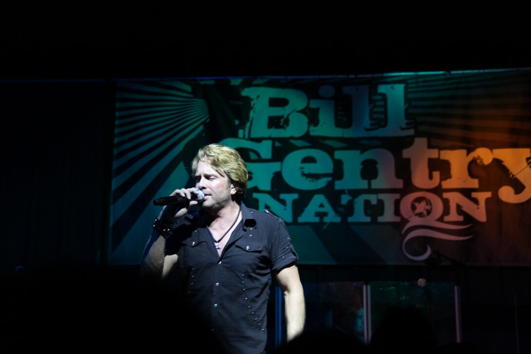 Bill Gentry sings a melody to the crowd during the 2011 WRNS Military Appreciation Concert that featured Heidi Newfield and him at the air station theater May 25.  Newfield and Gentry rocked the free concert as they paid tribute to the Marines, Sailors and their families and the sacrifice they make every day.
