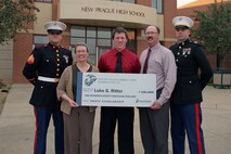 Sgt. Henry L. Freisner, Recruiting Substation Burnsville, and Capt. Jason H. Quehl present Luke G. Ritter, an 18-year-old senior, with the Naval Reserve Officers Training Corps Scholarship following New Prague High School's Scholarship and Honors Night May 25. Ritter's parents, Julie and Mark, were among the dozens of local residents who attended the ceremony. Freisner, 25, from Granby, Mo., enlisted Ritter into the Delayed Entry Program on June 1, 2010. He will be attending the University of Minnesota in the Fall.