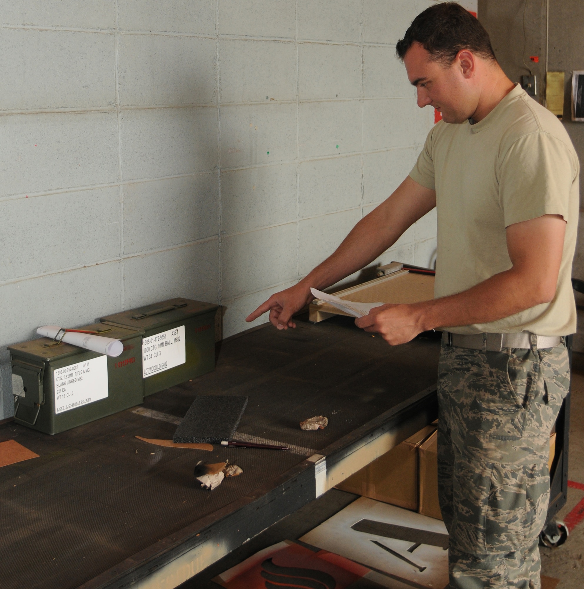YOKOTA AIR BASE, Japan -- Senior Airman Robert Gage, 374th Maintenance Squadron Munitions Flight stockpile surveillance crew member, verifies issue documents May 26, 2011, at Yokota Air Base. The Munitions Flight maintains equipment to continuously improve the contingency capabilities of the 374th Airlift Wing and tenant units.  