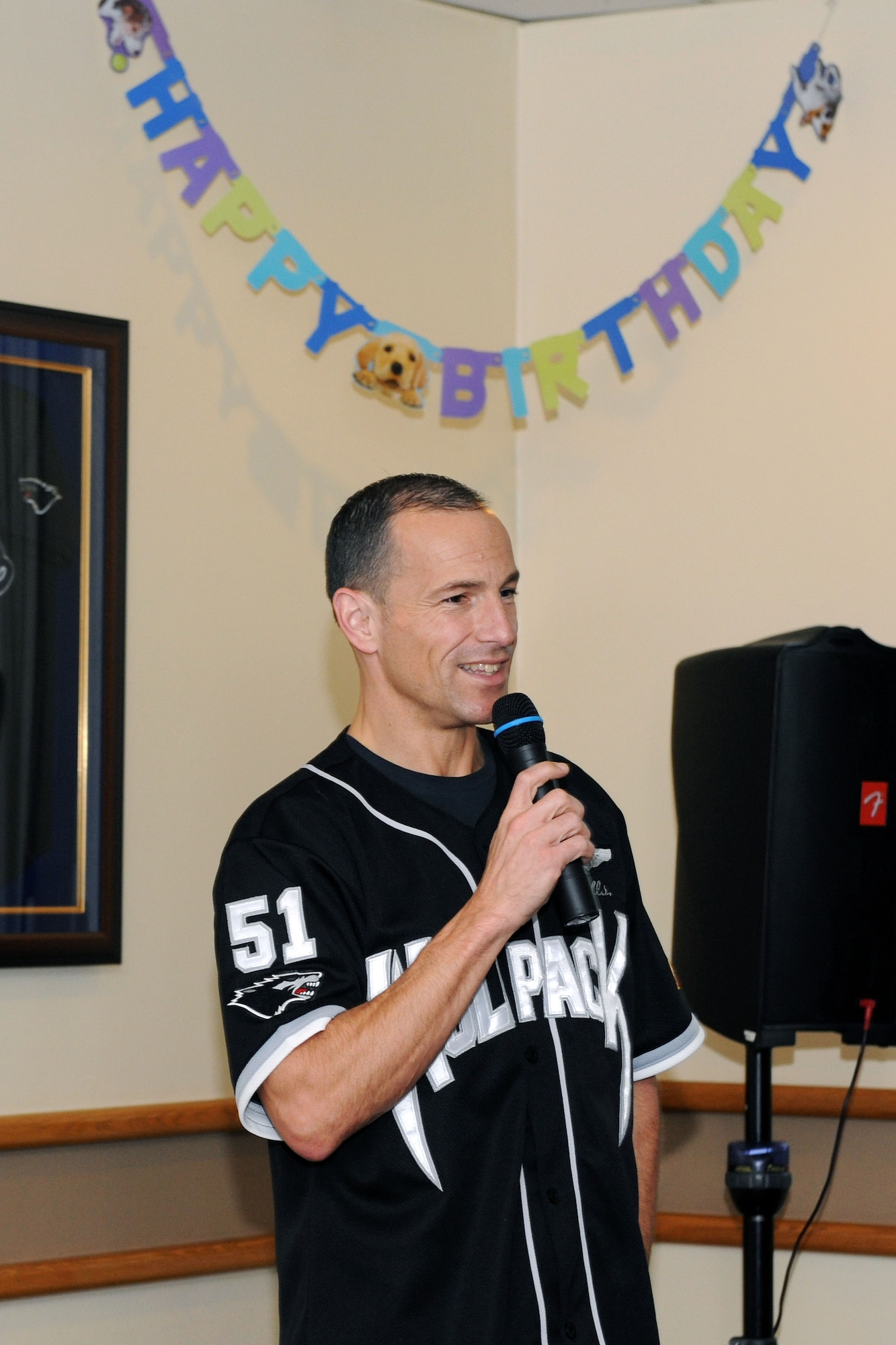 KUNSAN AIR BASE, Republic of Korea – Col. Scott Pleus, 8th Fighter Wing commander, welcomes Airmen to the dining facility for the birthday meal here May 24. During dinner females received roses and the oldest and youngest Airman got to cut the cake. (U.S. Air Force photo/Senior Airman Brittany Y. Bateman) 