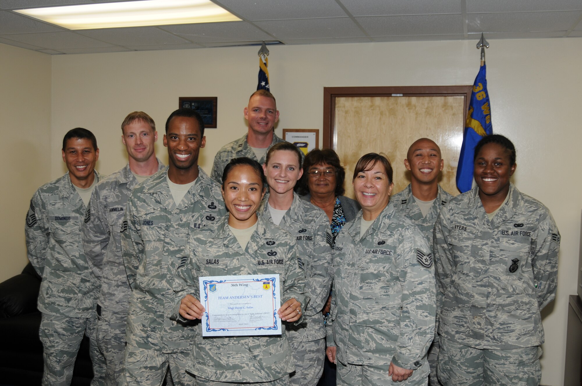 Staff Sgt. Daisy Salas (center), 36th Contingency Response Group, was awarded Andersen’s Best here May 25. Sergeant Salas leads a 13-person team, deployable to 42 countries in the Pacific Command’s area of responsibility. She provided security for the Pacific Air Forces commander, General Gary North’s visit to Bangladesh, and led the squadron’s Compliance Inspection preparation, leading to the wing’s only “Outstanding” rating. Additionally, Sergeant Salas performs duties as a jumpmaster for 36 CRG Airborne Operations, one of three 36 CRG jumpmasters. (U.S. Air Force photo/Senior Airman Carlin Leslie)