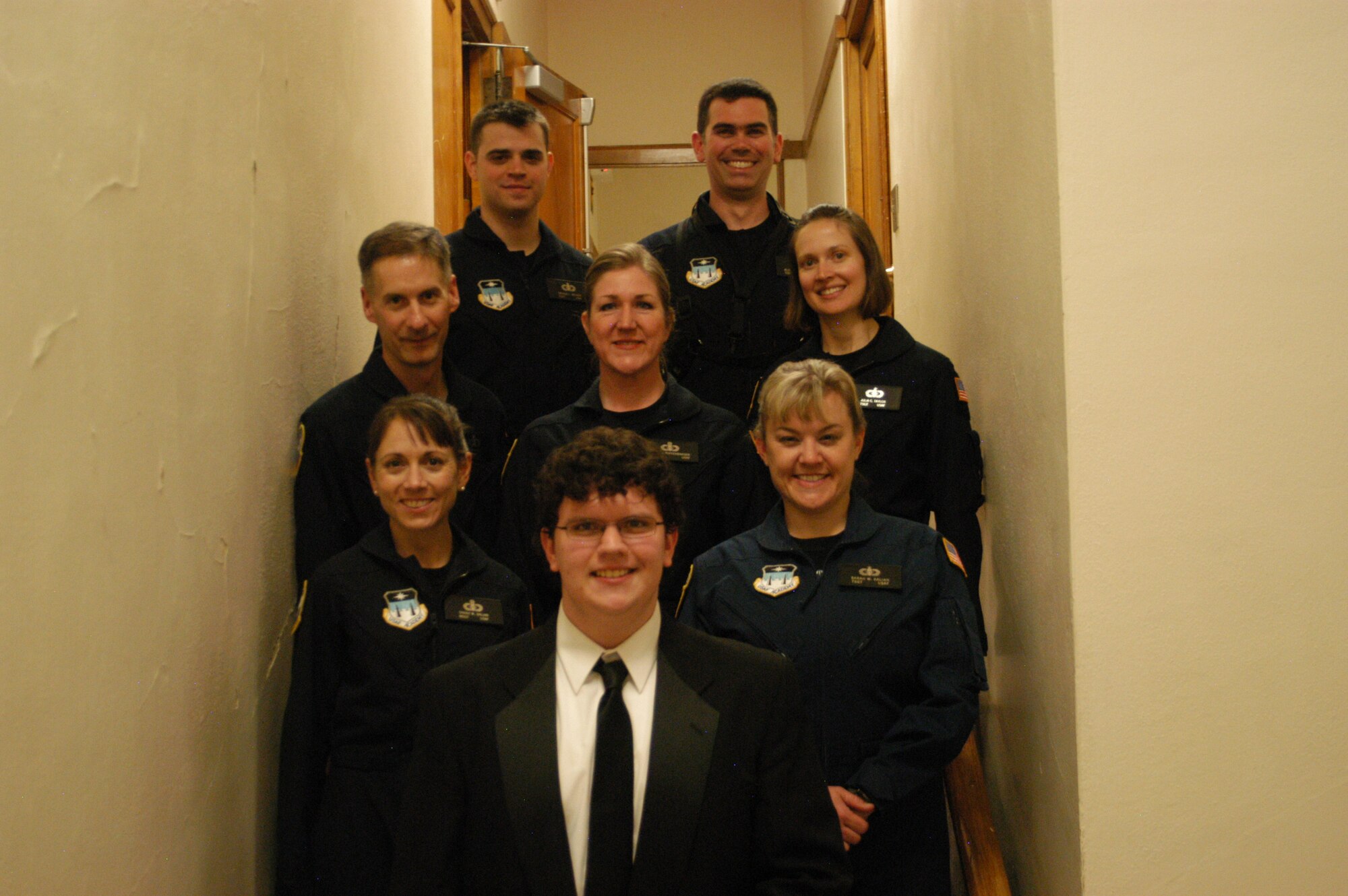 Academy Winds poses with a student musician from Grand Rapids, MN, who performed John Philip Sousa's "Manhattan Beach March" with Acaemy Winds during this evening's performance. Educational outreach is an important mission of the United States Air Force Academy Band, and Academy Winds strives to bring the Air Force message to students around the country.