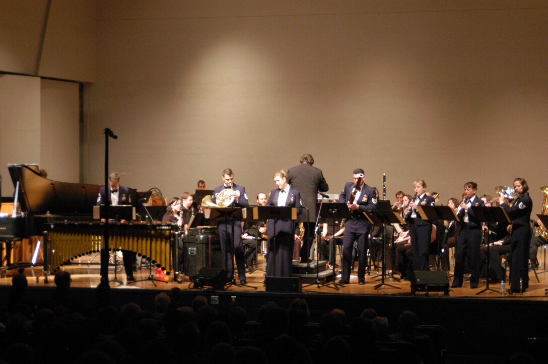 Academy Winds gives a landmark performance of a brand new arrangement by the USAF Academy Band's talented arranger, TSgt John Dawson. The arrangement brings together two tunes originally performed by Bela Fleck and the Flecktones, and gives Academy Winds an opportunity to show off their virtuosity as an ensemble in front of the St. Cloud State University Concert Band.