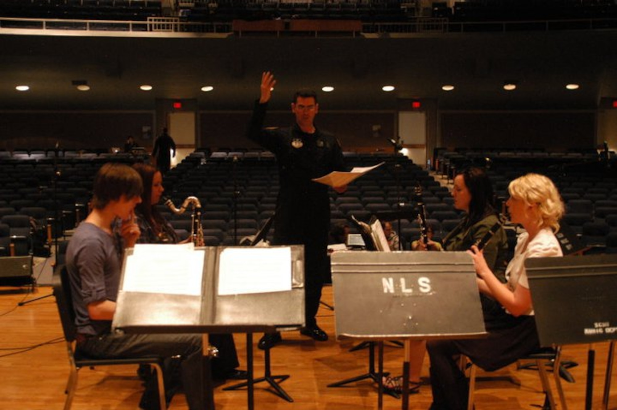 TSgt Alex Vieira coaches a clarinet quartet during a masterclass for the students at St. Cloud State University. Educational outreach is an important mission of the United States Air Force Academy Band, and Academy Winds brings decades of professional experience and knowledge to students around the country.