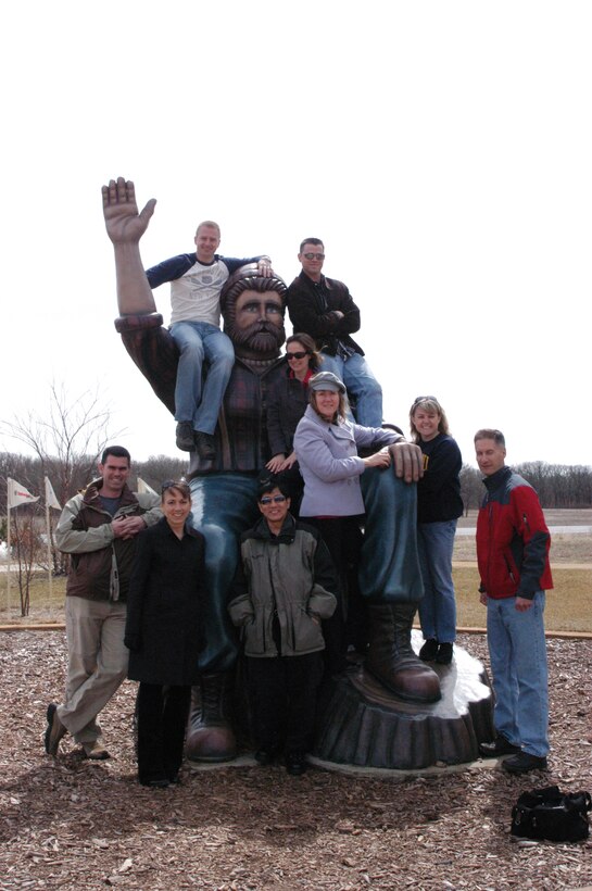 Academy Winds poses with the REAL Paul Bunyan on their way through Minnesota's Land of 10,000 Lakes