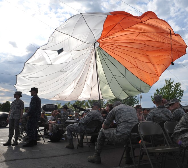 Volunteers and Armed Forces Torchlight Parade participants from Fairchild Air Force Base rally up for a burger burn hosted by the 336th Training Group May 21, 2011 before the Armed Forces Torchlight Parade in Spokane, Wash.  (U.S. Air Force photo/ Senior Airman Natasha E. Stannard)