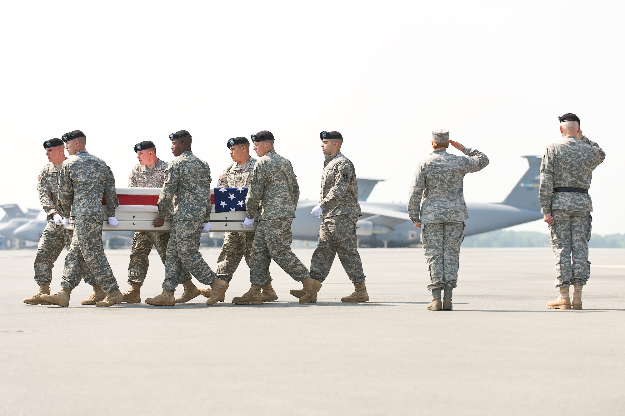 A U.S. Army carry team transfers the remains of Army Pvt. Thomas C. Allers, of Plainwell, Mich., at Dover Air Force Base, Del., May 25, 2011. Allers was assigned to the 2nd Battalion, 27th Infantry Regiment, 3rd Brigade Combat Team, 25th Infantry Division, Schofield Barracks, Hawaii. (U.S. Air Force photo/Roland Balik)