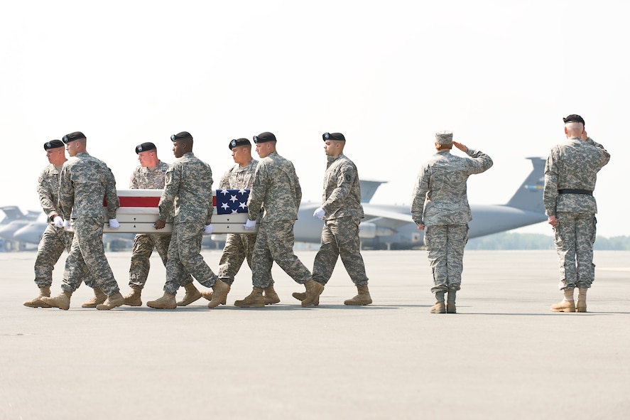 A U.S. Army carry team transfers the remains of Army Pvt. Thomas C. Allers, of Plainwell, Mich., at Dover Air Force Base, Del., May 25, 2011. Allers was assigned to the 2nd Battalion, 27th Infantry Regiment, 3rd Brigade Combat Team, 25th Infantry Division, Schofield Barracks, Hawaii. (U.S. Air Force photo/Roland Balik)