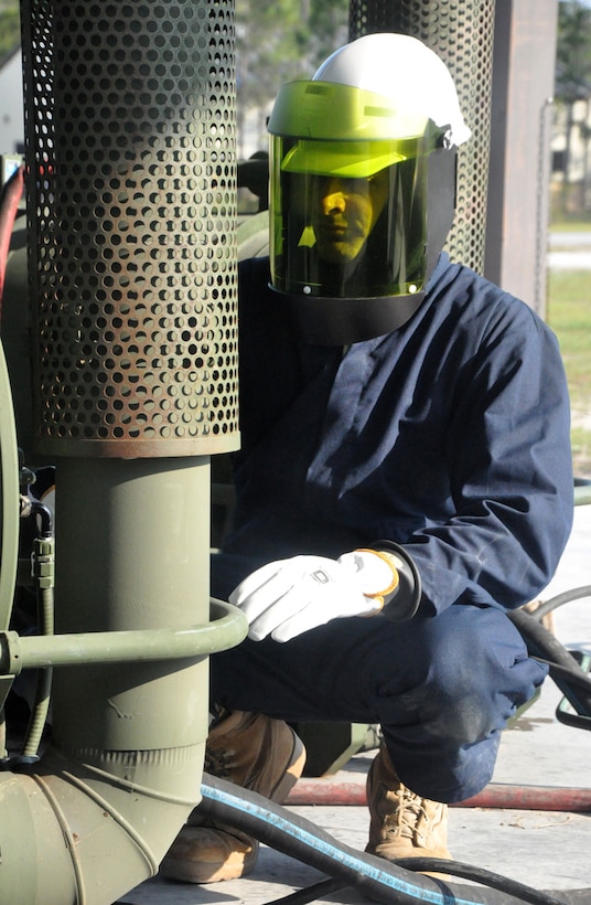 U.S. Air Force Master Sgt. John Wanner from the 446th Civil Engineer Squadron monitors the gauges on an M-80 water heater used in expeditionary base kitchens and latrines during a field exercise at Tyndall Air Force Base, Fla. on May 25, 2011. Sergeant Wanner is one of 30 Reservists from the 446th CES participating in Silver Flag 2011, a week-long training exercise designed to improve the readiness capability of Air Force civil engineers. Sergeant Wanner, of Olympia, Wash. is the HVAC (heating, ventilation and air conditioning) shop supervisor with the 446th CES. (U.S. Air Force photo by Staff Sgt. Grant Saylor/Released) 