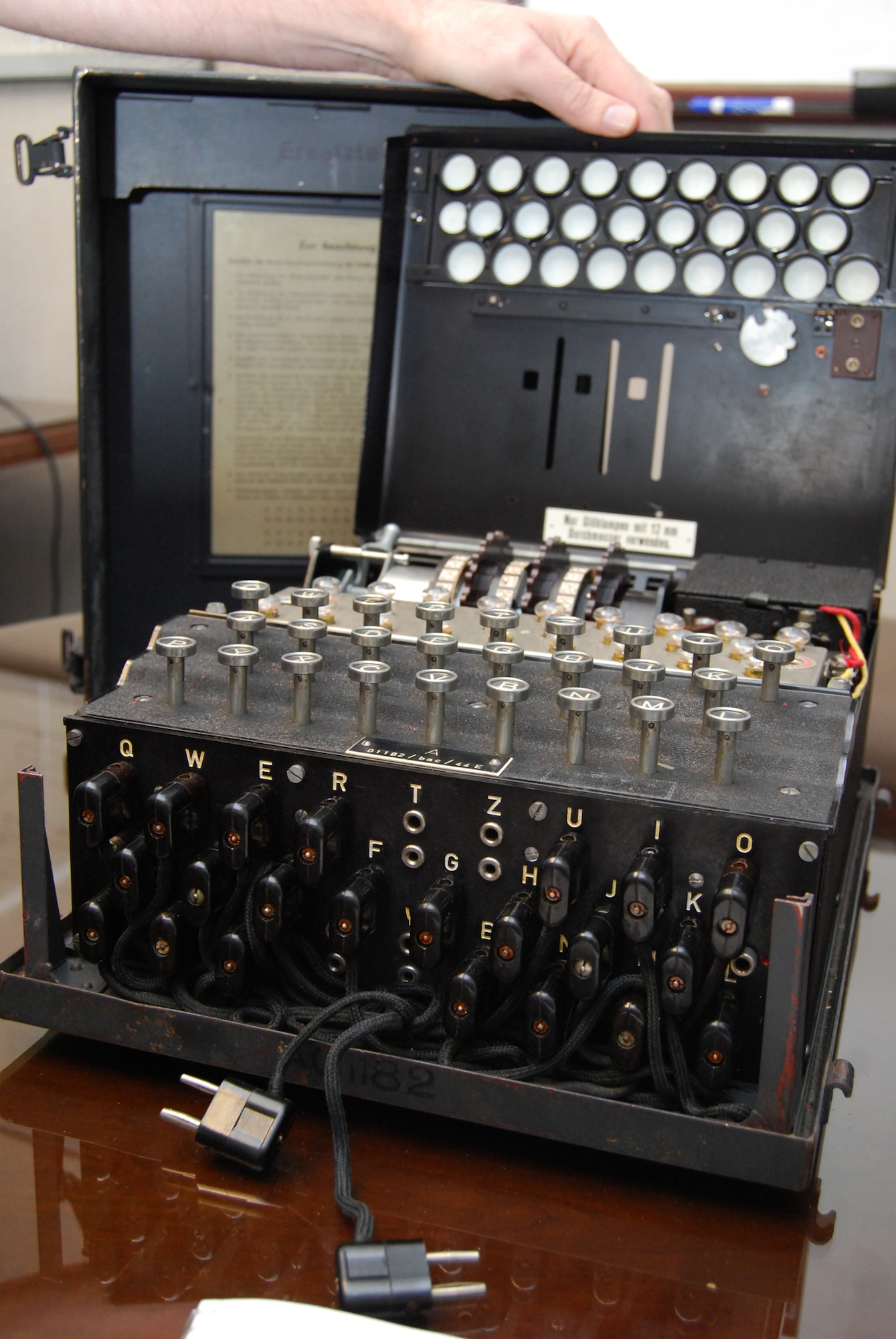 The Enigma machine pictured here is on permanent loan to the Air Force Academy Department of Computer Science from the National Cryptologic Museum at Fort George G. Meade, Md. The Computer Science department staff will use the machine in its Introduction to Computing class and its Cryptology class. This Enigma machine, Serial No. 01182, was used by the German Luftwaffe during World War II. (U.S. Air Force photo/Don Branum)

