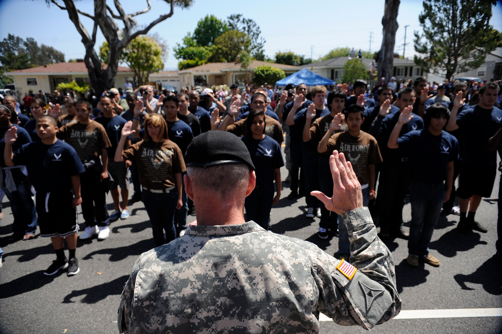 TORRANCE, Calif. -- Army Gen. Robert Cone, the Army Training and Doctrine Command commander, swears in men and women from all the branches of the military during Armed Forces Day Saturday, May 21, 2011.  The future military members marched in the 52nd Annual Armed Forces Day parade which ended with an enlistment ceremony.  (U.S. Air Force photo/Staff Sgt. Andrew Satran) 

  
 