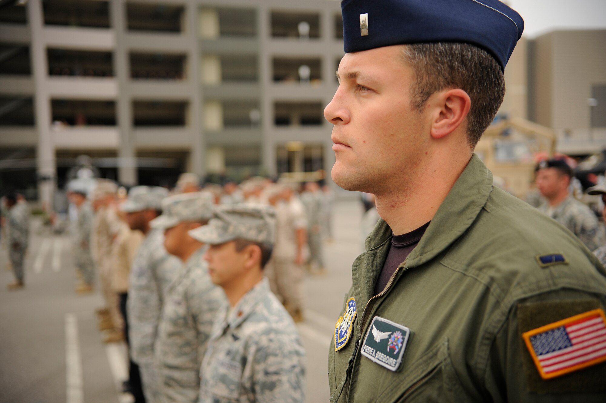 TORRANCE, Calif. -- 1st Lt. Pierre Gregoire, the 2nd Range Operations Squadron assistant flight commander of training, stands at attention during a reveille ceremony for Armed Forces Day at the Del Amo center here Saturday, May 21, 2011.  Soldiers, Marines, Sailors, Airmen, and Coast Guardsmen were in attendance for the ceremony.  (U.S. Air Force photo/Staff Sgt. Andrew Satran) 

 