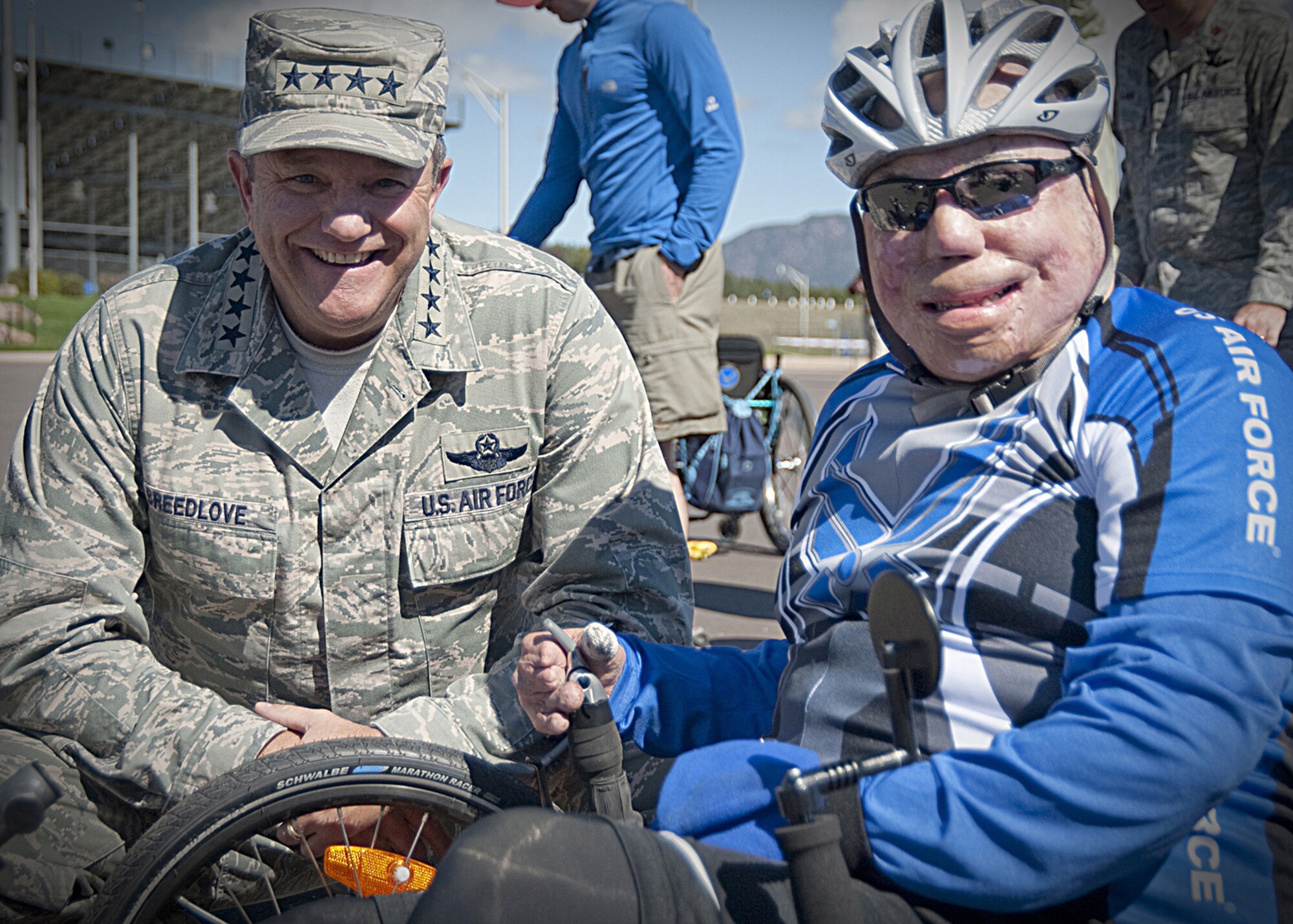Air Force Vice Chief of Staff Gen. Phil Breedlove congratulates Tech. Sgt. Israel Del Toro March 21, 2011, after he competed in the men's recumbent bicycle competition at the 2011 Warrior Games. The bicycle race was held at the United States Air Force Academy in Colorado Springs, Colo. (U.S. Air Force photo/Staff Sgt. J. Paul Croxon)