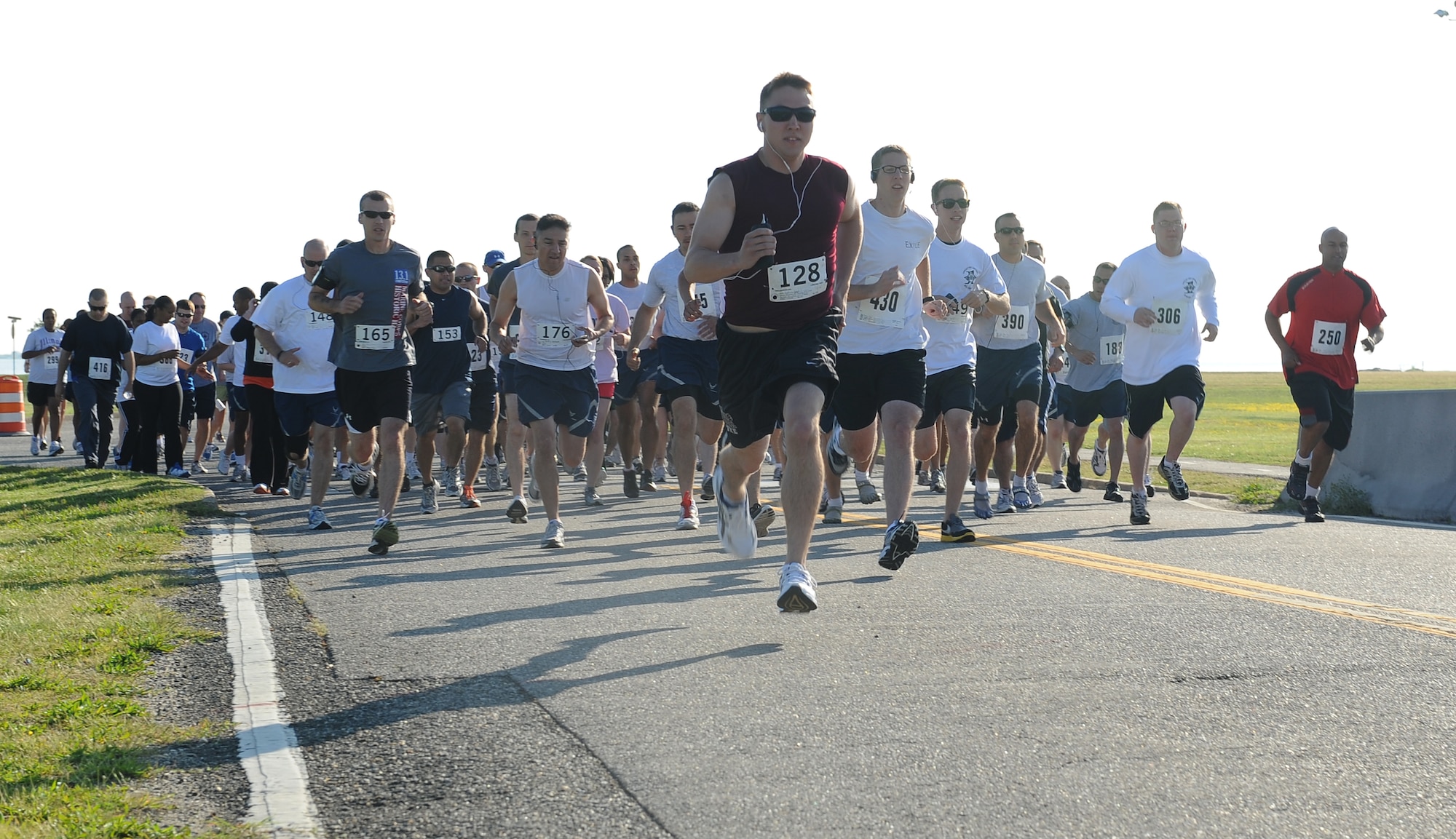 Airmen, families, and friends sprint at the start   the Langley First Sergeant’s Operation Warm Heart 5k Walk/Run at Langley Air Force Base, Va., May 20, 2011. More than $2,600 in proceeds  were donated to Operation Warm Heart, a year-round program designed to assist Airmen and their families.  (U.S. Air Force photo by Senior Airman Antoinette Gibson) (RELEASED)