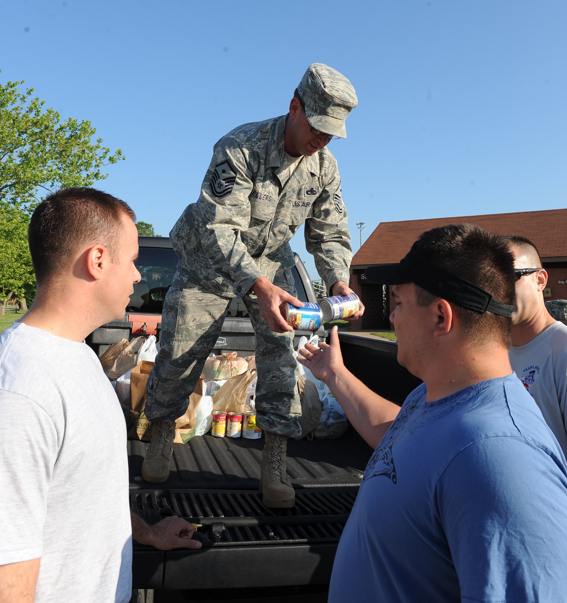 Master Sgt. Danny Sellers, 440th Supply Chain Operation Squadron first sergeant, collects canned goods from Airmen and their families at  the Langley First Sergeant’s Operation Warm Heart 5k Walk/Run at Langley Air Force Base, Va., May 20, 2011.  The First Sergeants Council donated more than  300 pounds of food  to the Foodbank of the Virginia Peninsula to support local Airmen and their families. (U.S. Air Force photo by Senior Airman Antoinette Gibson) (RELEASED)