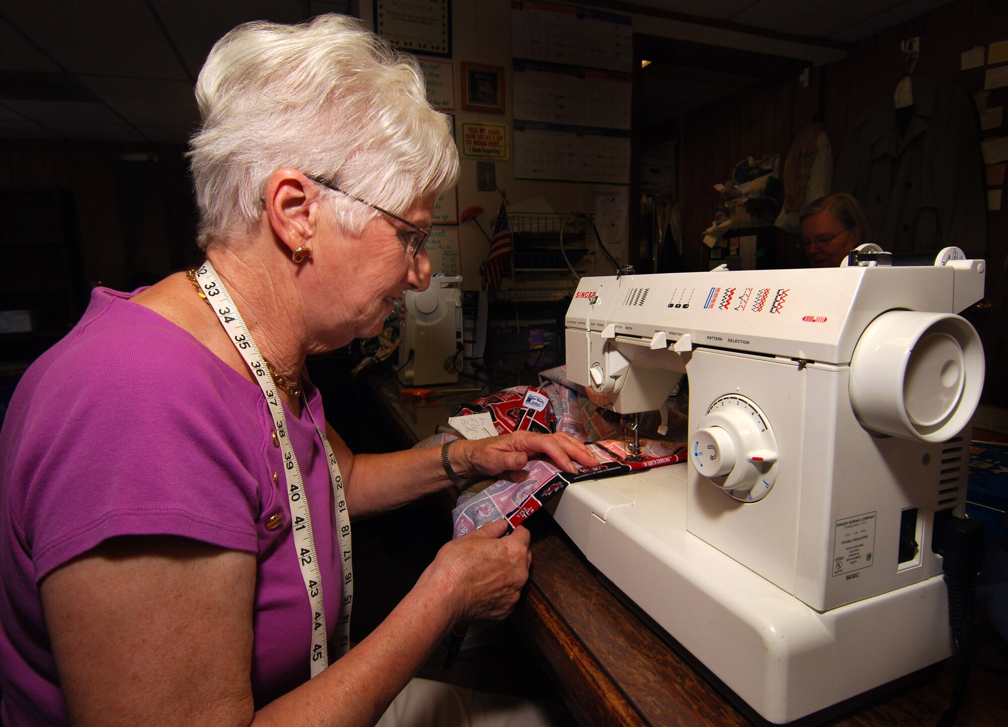 Thelma Jenkins sews a pair of pants destined for a wounded warrior in need of specialty clothing due to their injuries.  She volunteers with a local group of women to provide adaptive clothing for wounded warriors through the Sew Much Comfort volunteer charity organization.  Sew Much Comfort is a recognized charity, #12289 under the Combined Federal Campaign and they need your donations.    (U.S. Air Force photo/ Brad Fallin)