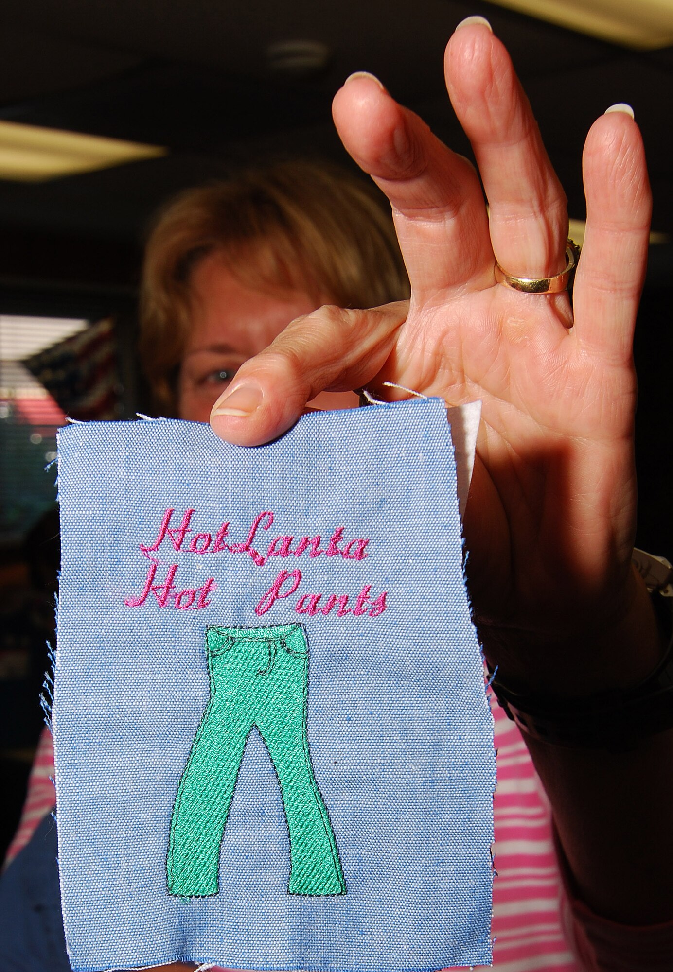 This is the HotLanta Hot Pants logo for the local chapter of Sew Much Comfort.  The ladies get together a couple of Fridays a month at the Dobbins Thrift store to provide adaptive clothing for wounded warriors through the Sew Much Comfort volunteer charity organization.  Sew Much Comfort is a recognized charity, #12289 under the Combined Federal Campaign and they could use your donations.    (U.S. Air Force photo/ Brad Fallin)