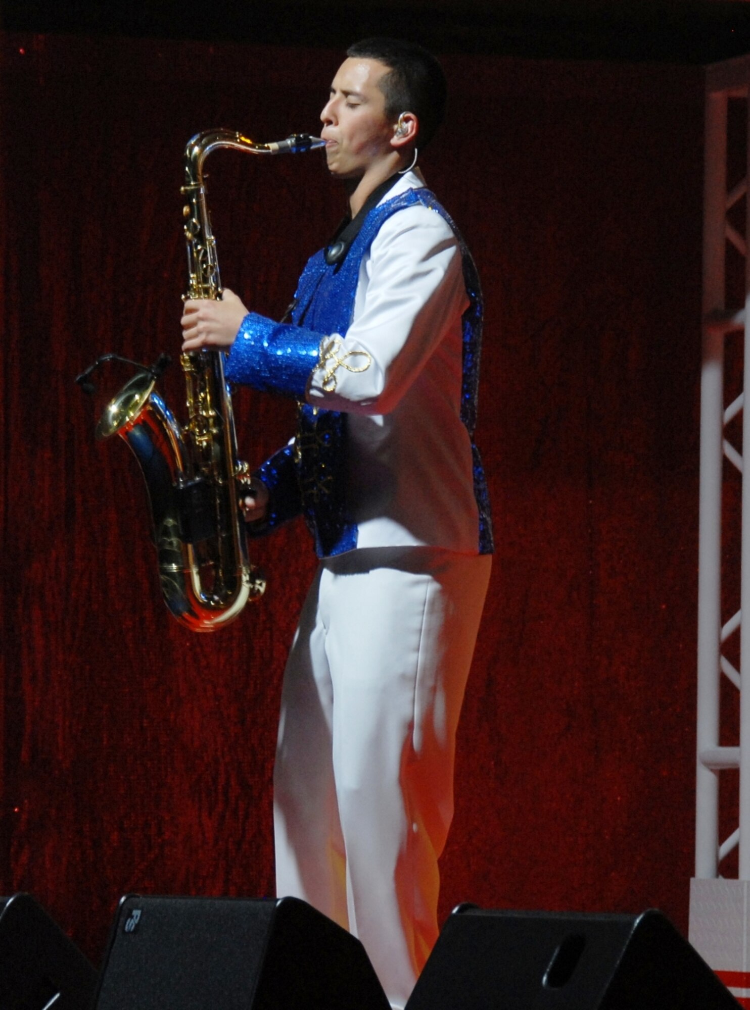 Airman 1st Class Gabriel Villanueva, 2011 Tops in Blue tenor saxophonist, plays a solo during the group's dress rehearsal May 20 at Kelly Air Force Base, Texas. The 2011 Tops in Blue team is set to kick off their 'Rhythm Nation' tour with a performance at Barksdale Air Force Base, La., tonight. The show provides a glimpse of a century of popular music and how it grew through new rhythms and technology. Airman Villanueva is an aircrew flight equipment apprentice from Dover Air Force Base, Del.  (U.S. Air Force photo/Erin Tindell)