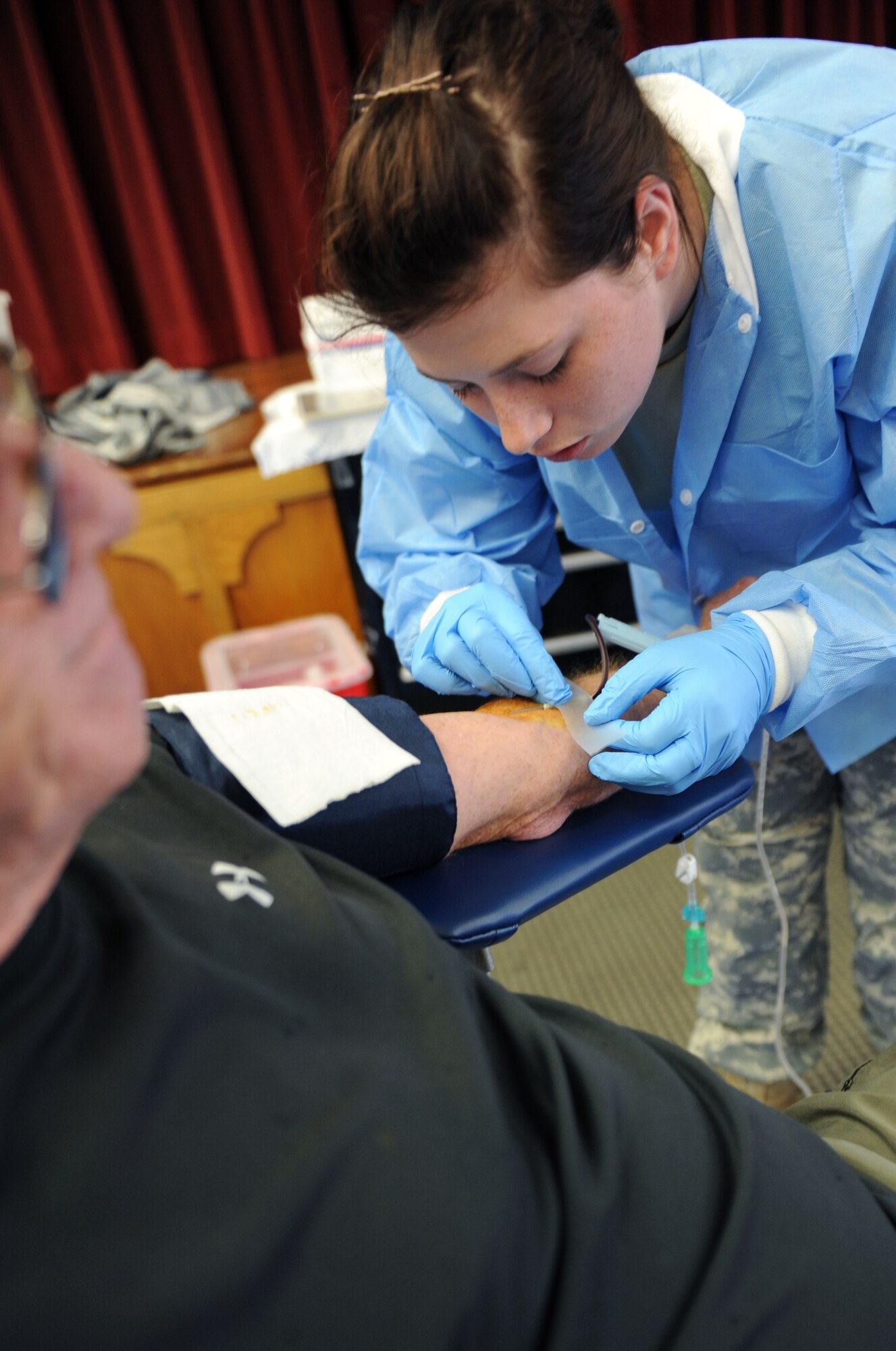 Jerry Davis, a retired military first sergeant, donates blood during the Armed Services Blood Program blood drive May 24, 2011, at Little Rock Air Force Base, Ark. Approximately 70 percent of donated blood will go to support Operations Enduring Freedom and New Dawn. (U.S. Air Force photo/Airman 1st Class Rusty Frank)