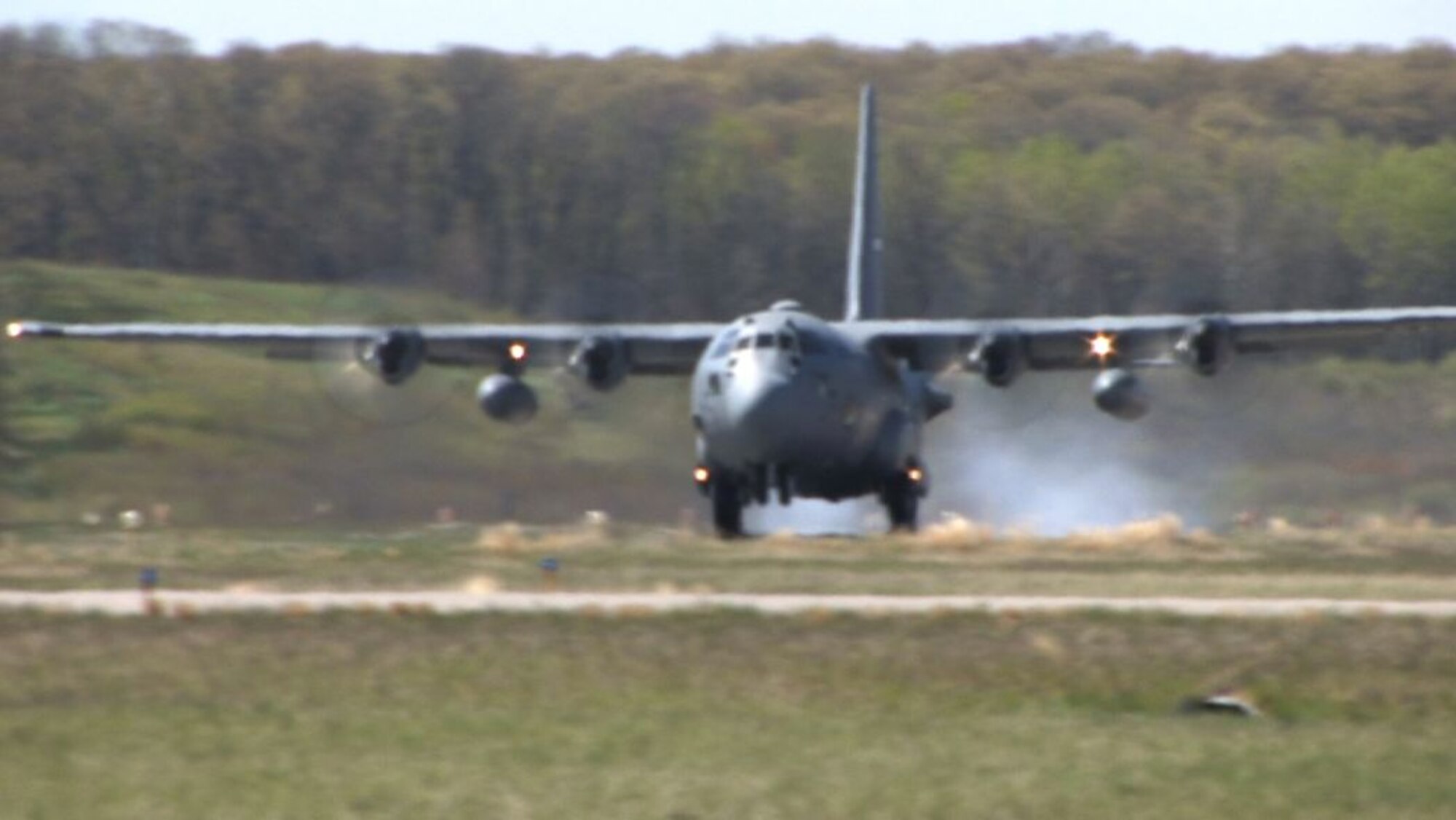 A 934th Airlift Wing C-130 practices takeoffs and landings on a dirt runway at Fort Ripley, Minn. The training prepares aircrews for missions to unimpoved airstrips in remote areas. (Air Force photo/Wendy Cormier)