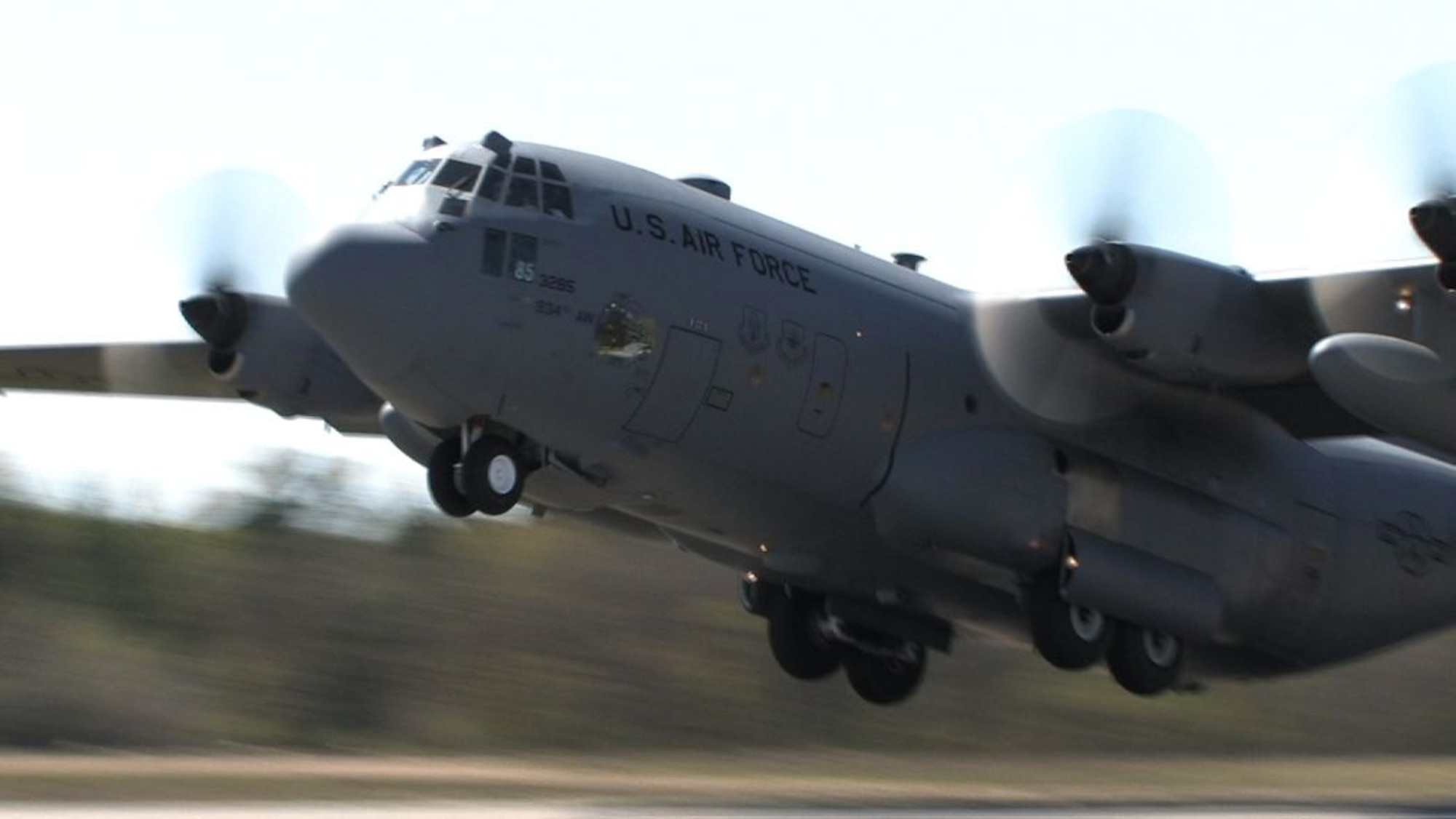 A 934th Airlift Wing C-130 practices takeoffs and landings on a dirt runway at Fort Ripley, Minn. The training prepares aircrews for missions to unimpoved airstrips in remote areas. (Air Force photo/Wendy Cormier)