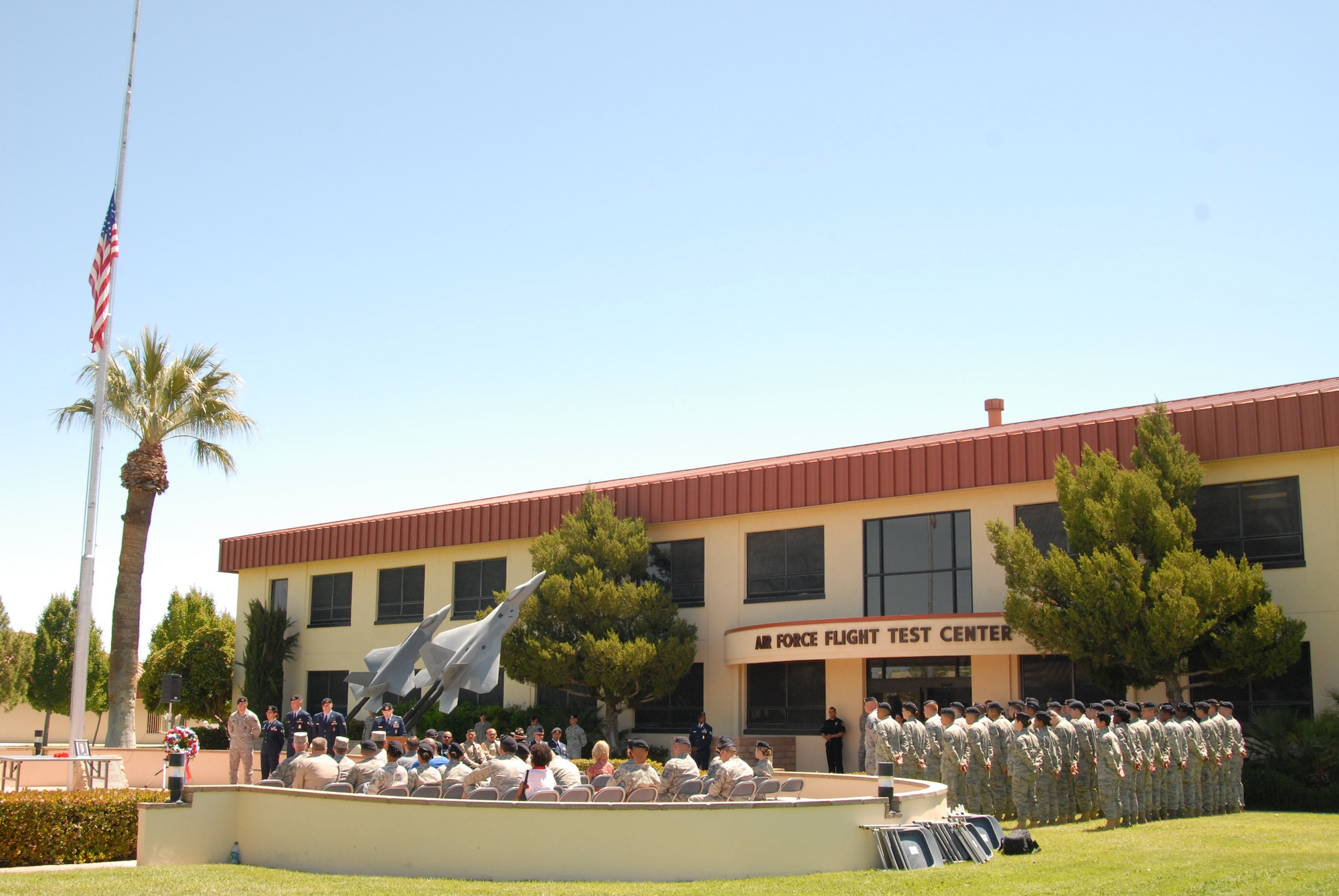 Team Edwards and local law enforcement representatives attend Edwards Air Force Base's Peace Officers Memorial Ceremony in front of Bldg. 1 May 20. The ceremony wrapped up this year's National Police Week, a week-long commemoration of the sacrifices and work of law enforcement officers around the country. (Air Force photo by Kenji Thuloweit)