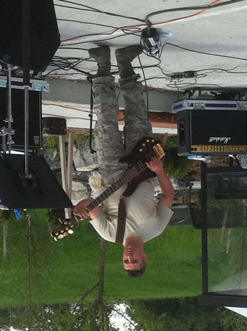 High Altitude performed on May 21, 2011 at Fort Indiantown Gap, Annville, PA. Pictured is bass guitar Tech. Sgt. Jeremy Buss. (Photo by Air Force Staff Sgt. Shawn Estes)