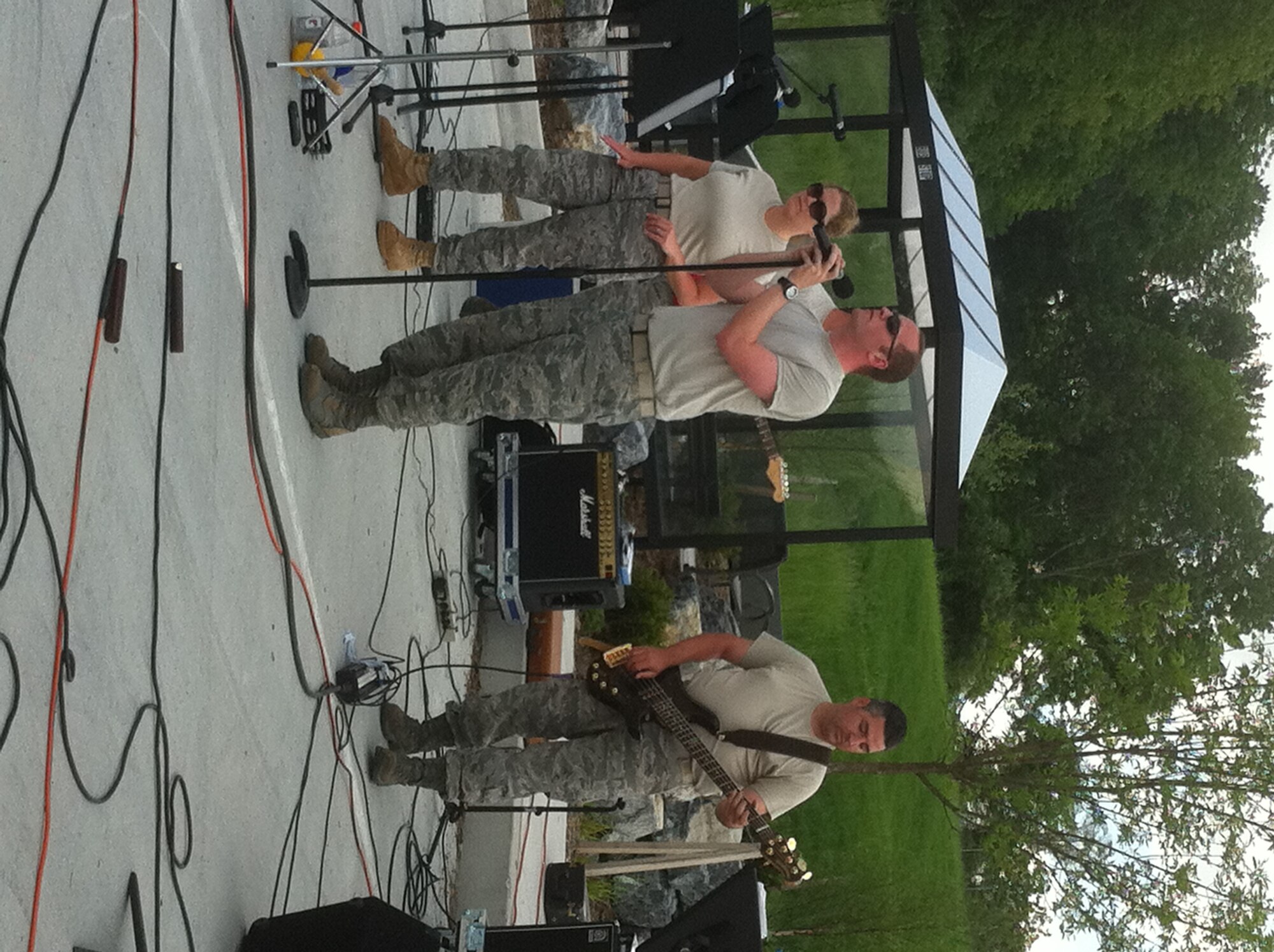High Altitude performed on May 21, 2011 at Fort Indiantown Gap, Annville, PA. Pictured are vocalists Tech. Sgt. Lori McCarty and SrA Clayton Lee and bass guitar Tech. Sgt. Jeremy Buss. (Photo by Air Force Staff Sgt. Shawn Estes)