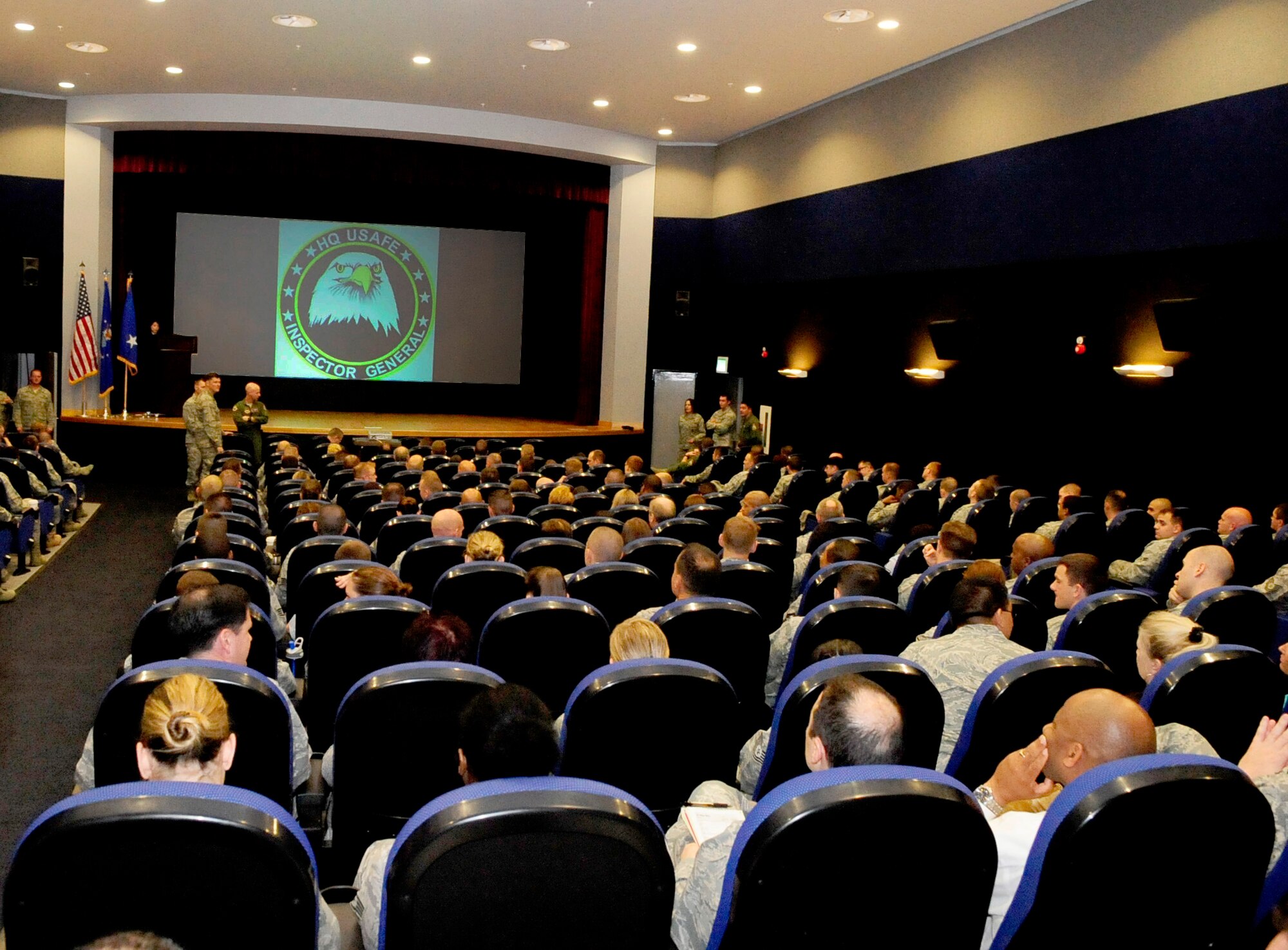 RAF MILDENHALL, England -- Team Mildenhall gathers in the base theater for the results of the U.S. Air Forces in Europe Inspector General unit compliance inspection, here May 23, 2011. The 100th Air Refueling Wing was rated "in compliance" which is the highest rating that can be earned in the inspection. (U.S. Air Force photo/Senior Airman Ethan Morgan)