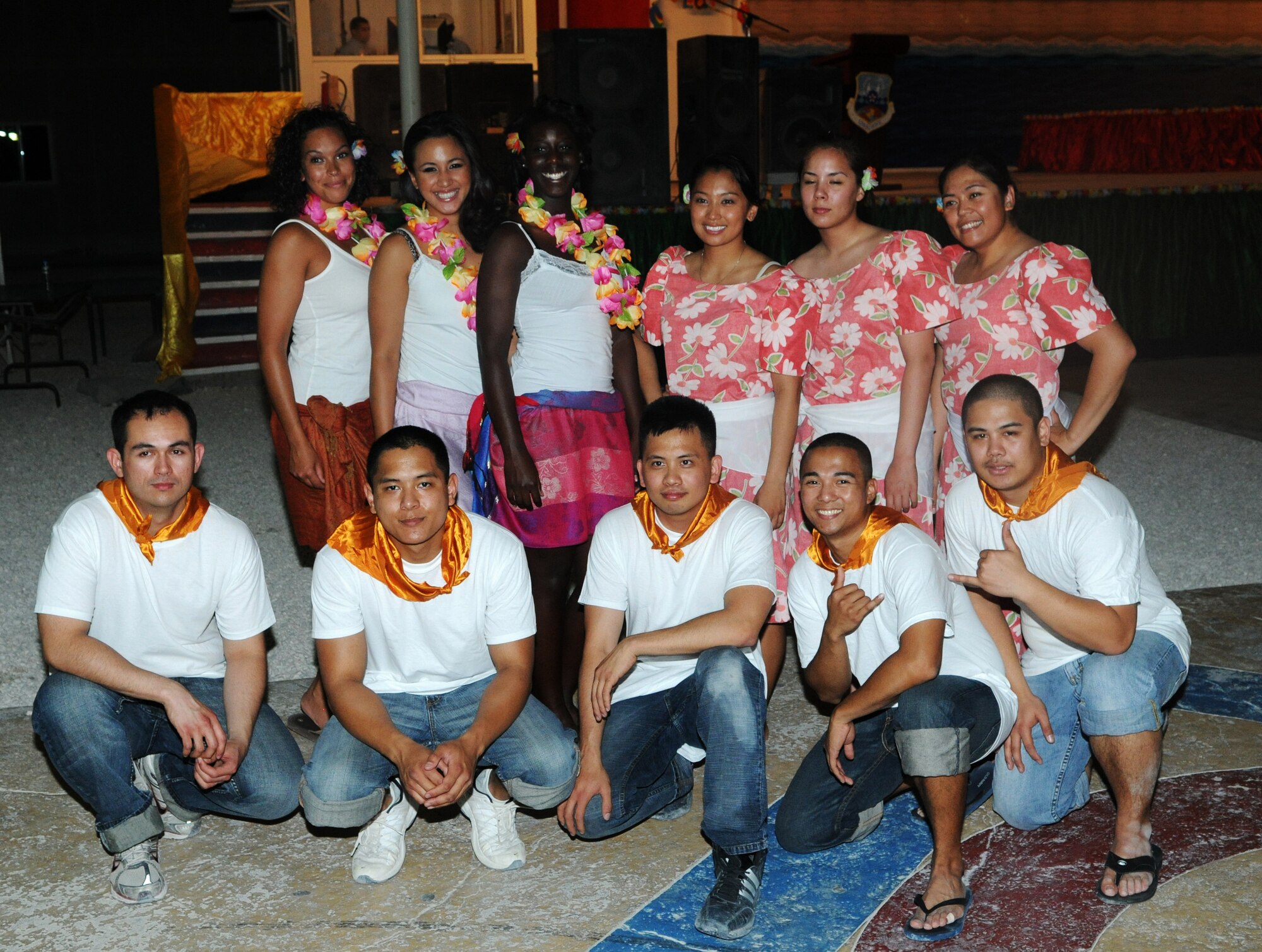 Members of the 379th Asian Pacific American Association pose for a photo during the Asian Luau May 21 in Southwest Asia.  (U.S. Air Force photo/ Staff Sgt. Anthony Graham)