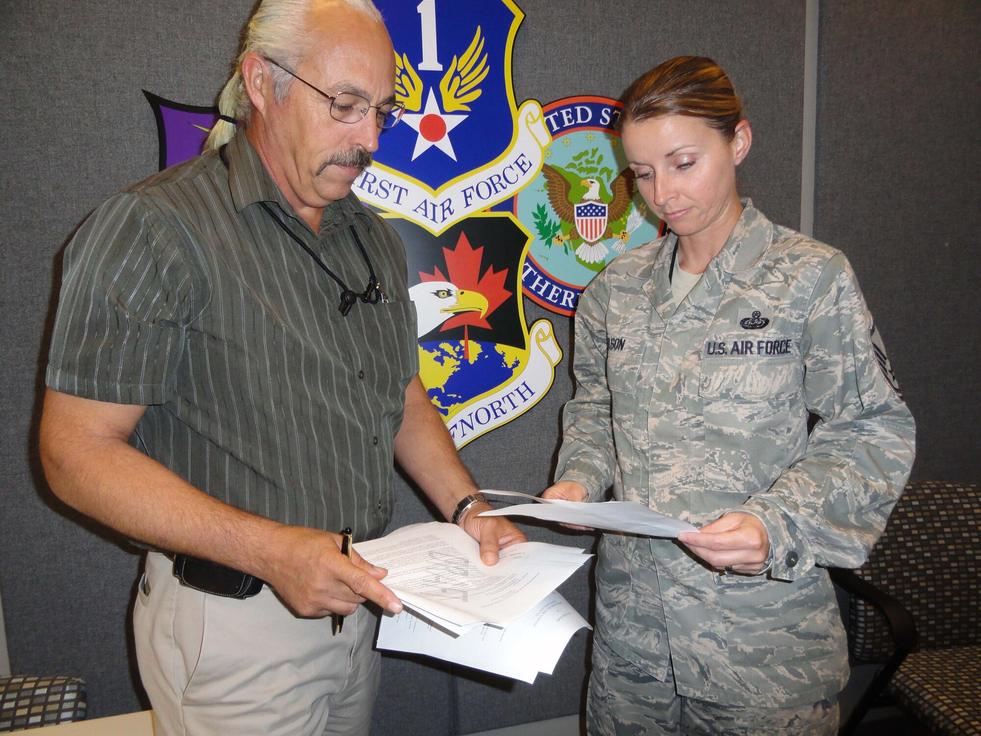 Roberto de los Santos and Master Sgt. Terry Olson were recently named as Air Combat Command’s Outstanding Contributors of the Year (Civilian and Enlisted) to the field of information operations. The duo, who work for Air Forces Northern’s communications directorate, will now compete for their respective awards at the Air Force level. (U.S. Air Force photo by Angela Pope)