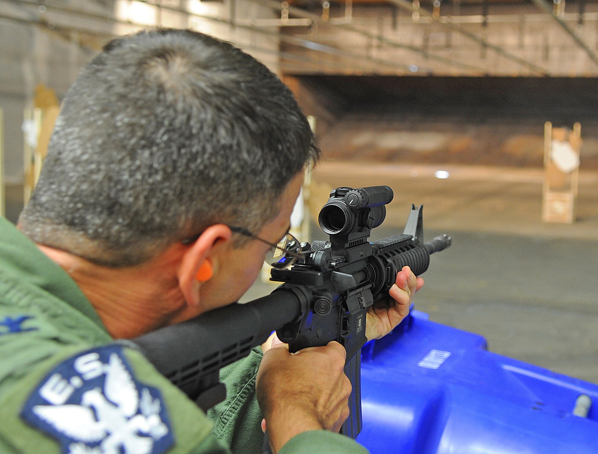 SEYMOUR JOHNSON AIR FORCE BASE, N.C. -- Col. Brian Kirkwood, 4th Operations Group commander, fires an M-4 Carbine during the National Police Week shoot-off competition here May 20, 2011. Competitors had to complete two shooting courses within the allotted time. The most accurate competitor won the shoot-off. (U.S. Air Force photo/ Senior Airman Gino Reyes)(Released)