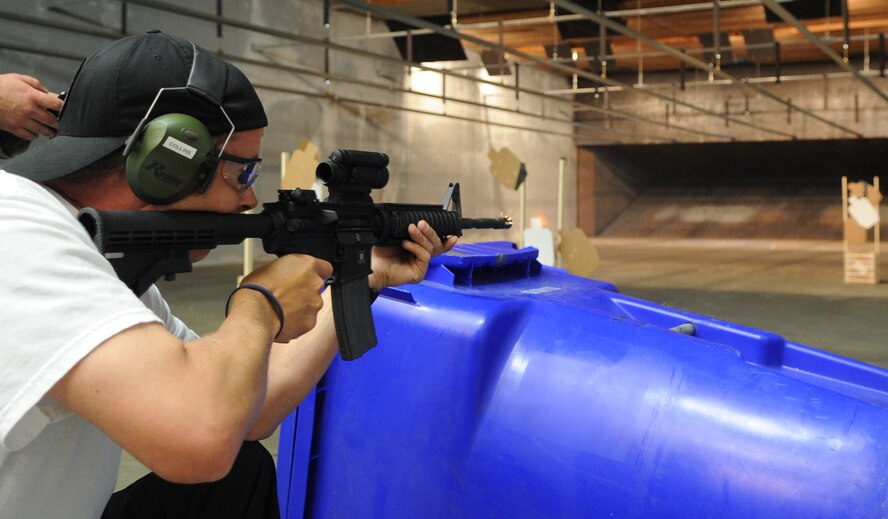SEYMOUR JOHNSON AIR FORCE BASE, N.C. -- Neal Linch, Goldsboro Police Task Force, fires an M-4 Carbine during the National Police Week shoot-off competition here May 20, 2011. Tech. Sgt. David Bargor, 4th Security Forces Squadron, won first place at the competition, followed respectively by Officers Collins and Ravine of the Goldsboro Police Department. (U.S. Air Force photo/Senior Airman Gino Reyes)(Released)