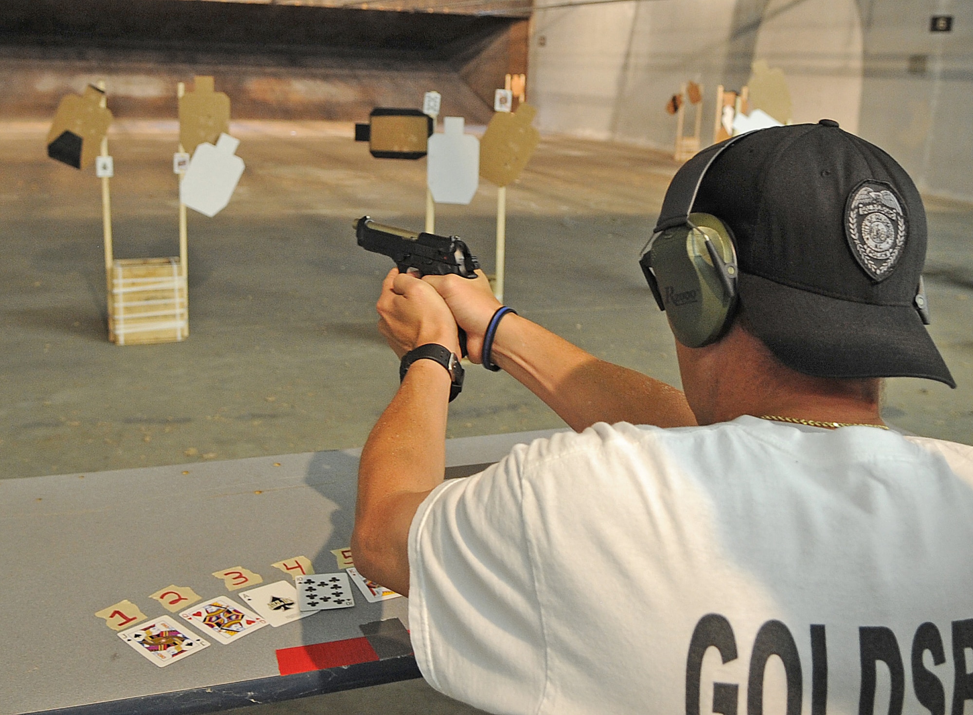 SEYMOUR JOHNSON AIR FORCE BASE, N.C. -- Neal Linch, Goldsboro Police Task Force, fires an M-9 pistol during the National Police Week shoot-off competition here May 20, 2011. Participants of the competition included members of the Goldsboro Police Department, State Highway Patrol, 4th Security Forces Squadron, Air Force Office of Special Investigations, Southeastern Protective Services. Col. Brian Kirkwood, 4th Operations Group commander, and Lt. Col. Howell, 4th Training Squadron director of operations also took part in the competition. (U.S. Air Force photo/Senior Airman Gino Reyes)(Released) 