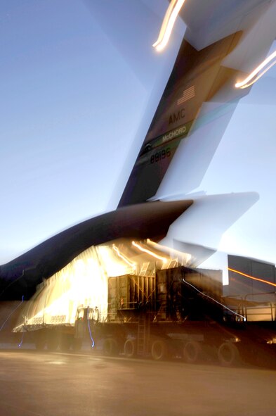 Cargo is loaded onto a C-17 Globemaster III assigned to the 385th Air Expeditionary Group at Kandahar Airfield, Afghanistan, for a flight to Mihail Kogalniceanu Air Base, Romania, on May 20, 2011. Several C-17s are temporarily deployed to MK from another base in the region that is closed for routine runway repairs. (U.S. Air Force Photo/Master Sgt. Laura K. Deckman) 
