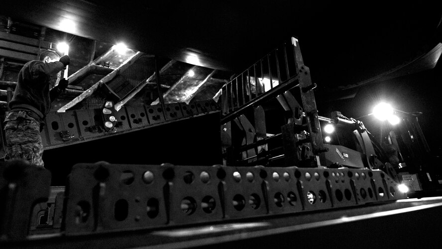 Airmen from the 621st Contingency Response Wing and 385th Air Expeditionary Group off-load cargo from a C-17 Globemaster III after a flight from Kandahar Airfield, Afghanistan, to Mihail Kogalniceanu Air Base, Romania, on May 20, 2011. Several C-17s are temporarily deployed to MK from another base in the region that is closed for routine runway repairs. (U.S. Air Force Photo/Master Sgt. Laura K. Deckman) 