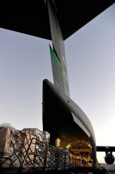 A C-17 Globemaster III assigned to the 385th Air Expeditionary Group is off-loaded at Kandahar Airfield, Afghanistan, after a flight from Mihail Kogalniceanu Air Base, Romania, on May 20, 2011. The aircraft delivered cargo supporting Operation Enduring Freedom. Several C-17s are temporarily deployed to MK from another base in the region that is closed for routine runway repairs. (U.S. Air Force Photo/Master Sgt. Laura K. Deckman)