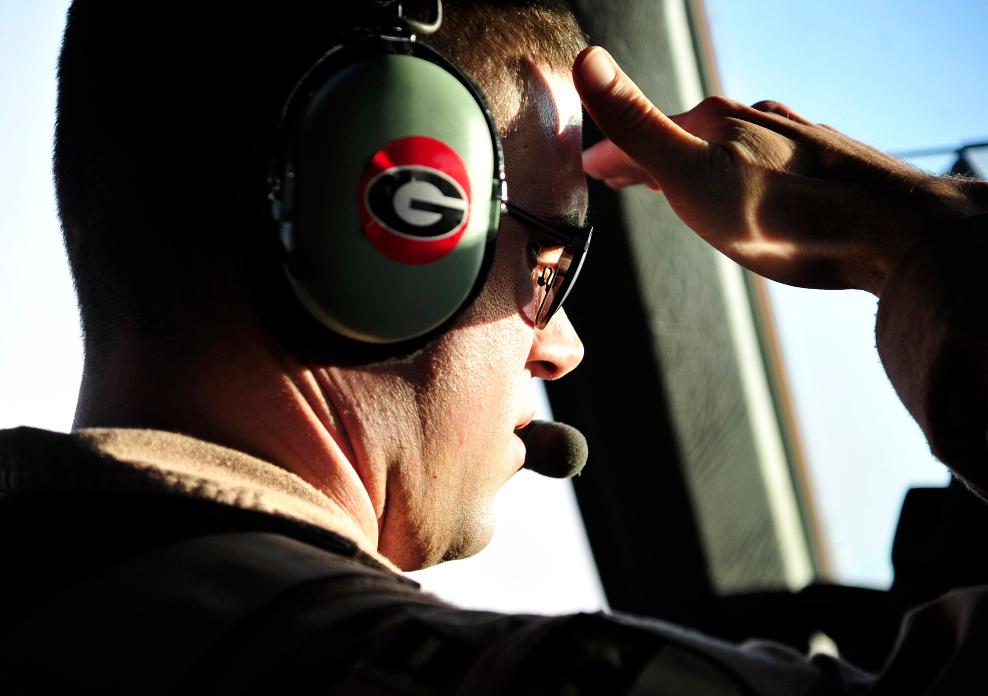Capt. Jacob Fox, 17th Airlift Squadron aircraft commander, performs pre-flight operations during a flight in a C-17 Globemaster III from Mihail Kogalniceanu Air Base, Romania, to the U.S. Central Command theater of operation May 20.  The crew flew from MK airfield to Kandahar Air Base, Afghanistan, carrying critical cargo supporting Operation Enduring Freedom.  Several C-17s are temporarily deployed to MK from another base in the region that is closed for routine runway repairs.  (U.S. Air Force photo by Master Sgt. Laura K. Deckman/released)