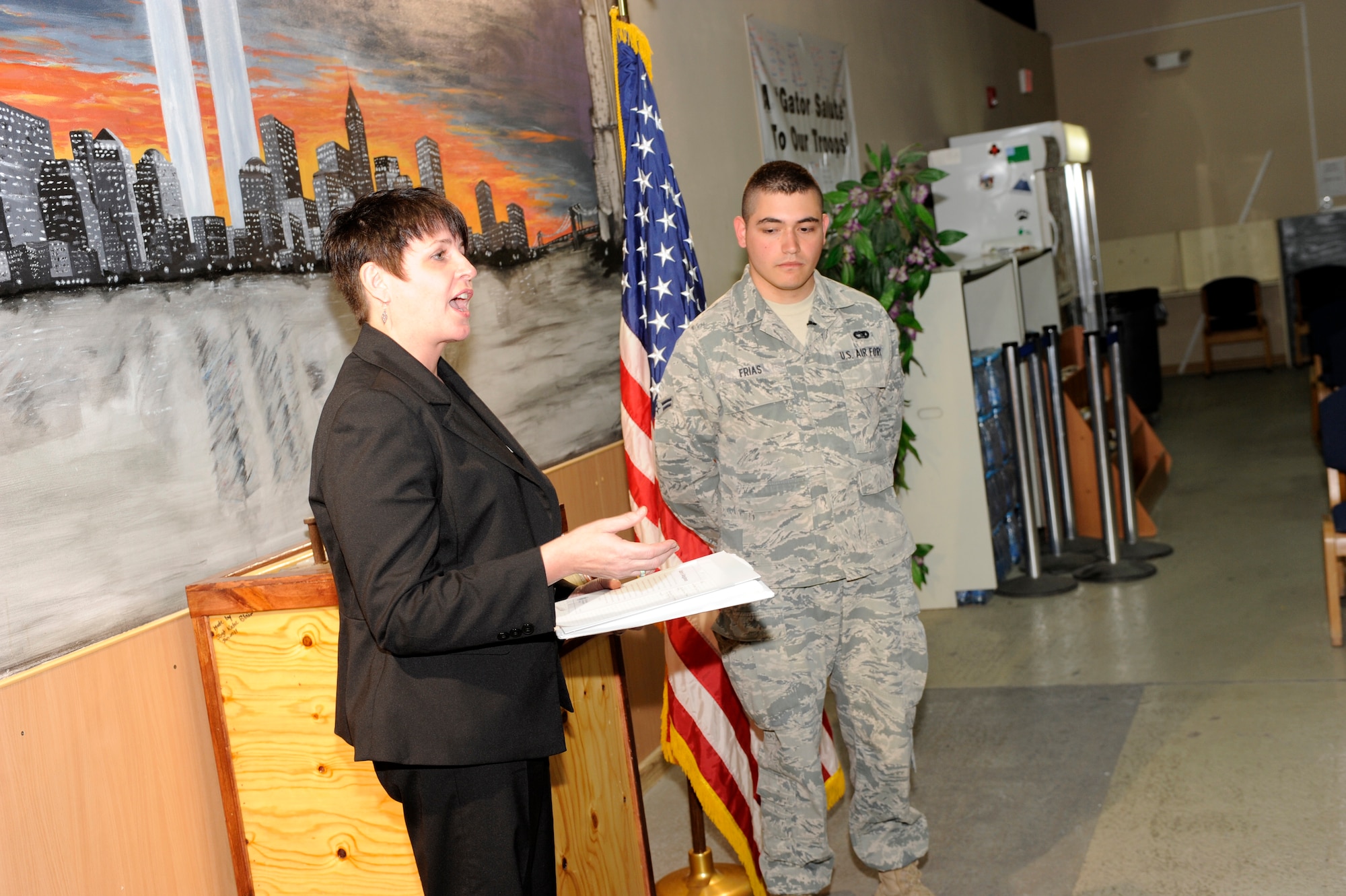 TRANSIT CENTER AT MANAS, Kyrgyzstan -- Ms. Susan Aikman, U.S. Citizenship and Immigration Management Field Office in Moscow, and Airman 1st Class Jose Frias, 376th Expeditionary Logistics Readiness Squadron Passenger Terminal representative, discuss ceremony procedures in the PAX terminal here May 25.  
Airman Frias, a Tampico, Mexico native and two-years time in service said he's excited to be the first in his family to earn U.S. citizenship. (U.S. Air Force photo by Tech. Sgt. Jerome C. Baysmore)