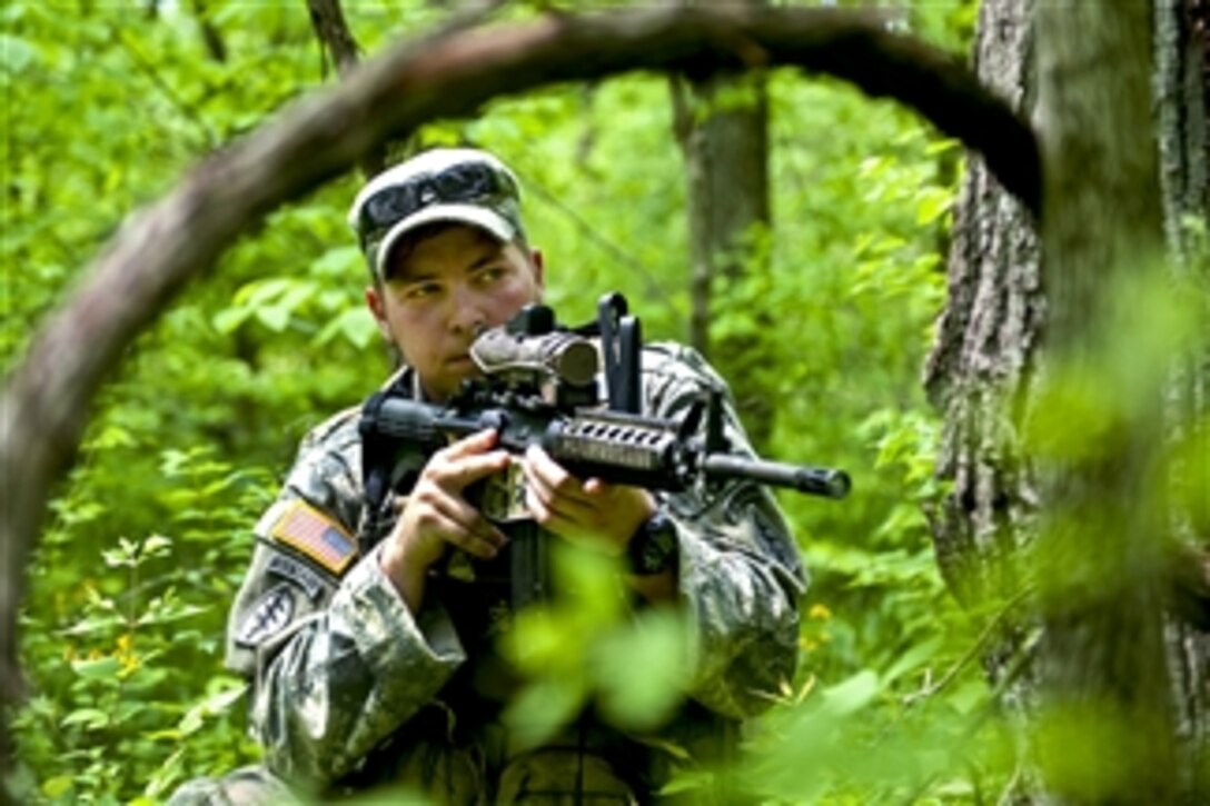 A U.S. Army soldier provides security for his team during a foot patrol while training at Camp Atterbury Joint Maneuver Training Center, Ind., on May 12, 2011.  The soldier is assigned to the 2nd Battalion, 19th Special Forces Group.  