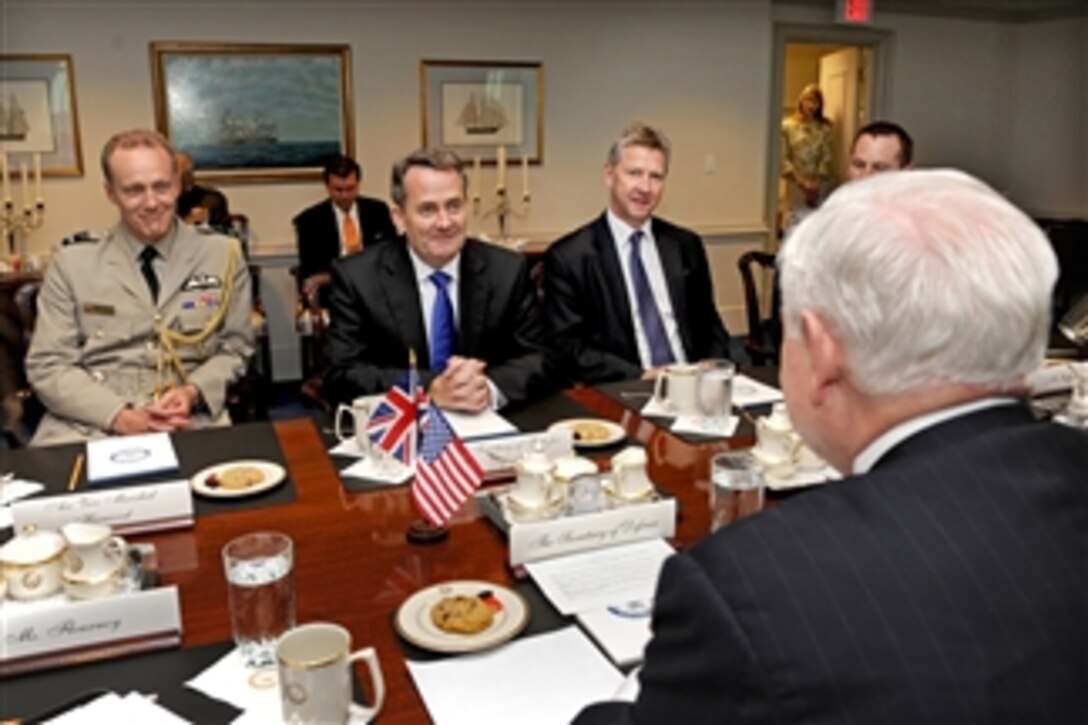 British Defense Minister Liam Fox (3rd from right) meets with Secretary of Defense Robert M. Gates (right) in the Pentagon on May 24, 2011.  The meeting will cover security issues of mutual interest to both nations including the current situation in Libya.  Joining Fox are British Defense Attache Air Vice Marshal Mike Harwood (left) and Minister of DefenseMaterial Will Jessett.  