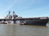USS Iwo Jima sails to Pier 88 during Fleet Week 2011 parade of ships. More than 3000 Marines, Sailors and Coast Guardsmen will participate in community outreach events and military demonstrations throughout the city. Fleet Week 2011 begins May 25 and continues through June 1.