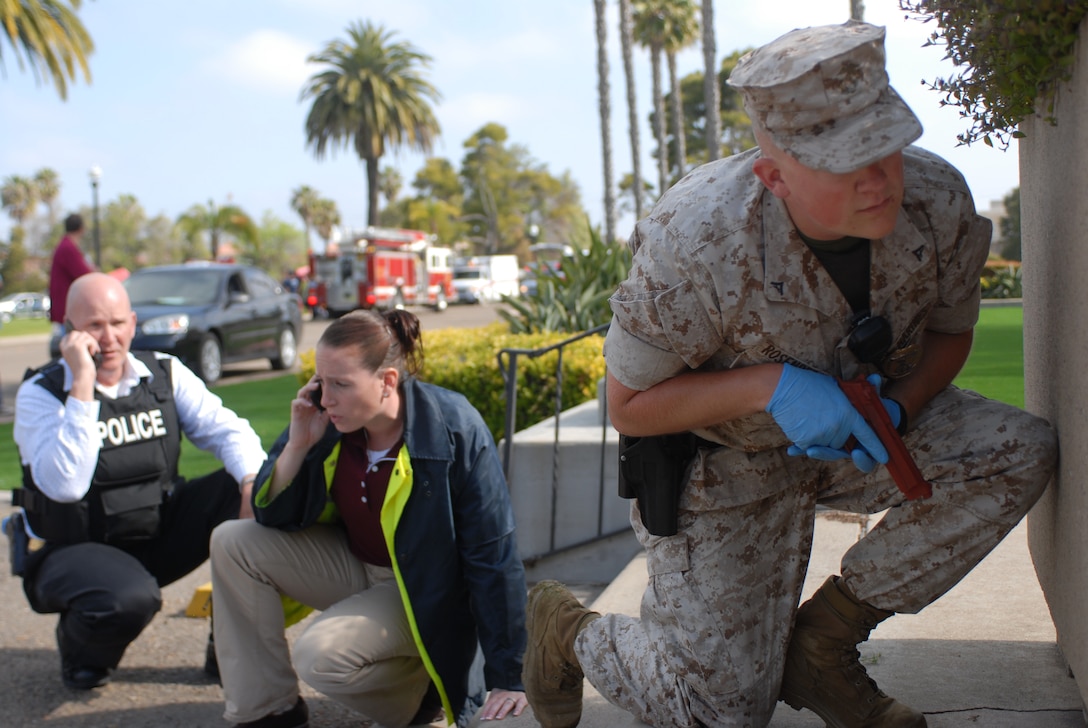 Lance Cpl. Paul D. Rosenberg, military police at MCRD, helps secure the perimeter of the Commanding General's building, where the hostage is being held. The Emergency Negotiation Team arrived to the scene to set-up communications with hostile.