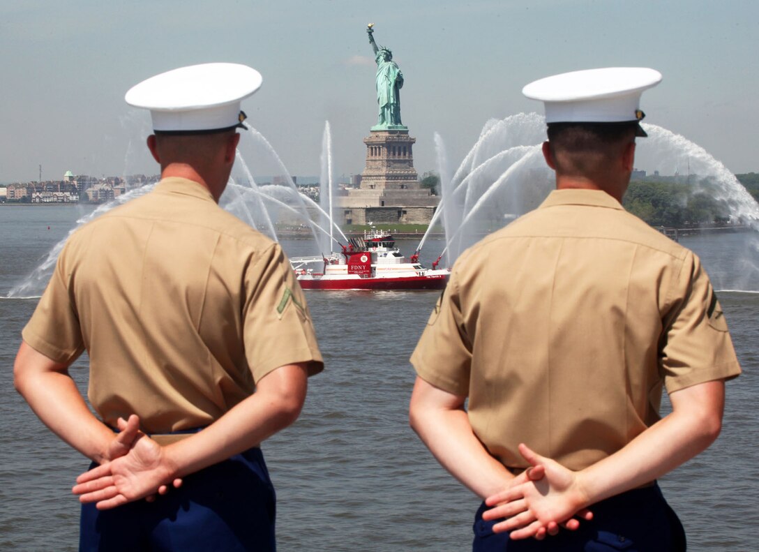 Marine and Sailors aboard the USS Iwo Jima (LHD-7) Man the Rails, as the ship pulls into the New York City harbor May 24, 2011. Various units from II Marine Expeditionary Force and Marines Forces Reserve have organized under the 24th MEU to form the Special Purpose Marine Air Ground Task Force - New York. The Marines are embarking on the Navy's Amphibious Assault Ships, the USS Iwo Jima (LHD -7) and USS New York (LPD-21) to take part in New York City's Fleet Week from May 25 to June 1, 2011. There, the Marines will showcase the capabilities of the MAGTF, and also honor those who have served by participating in various events during the Memorial Day weekend.