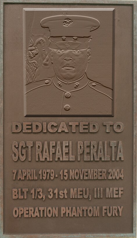 A plaque hanging near the entrance of Peralta Hall, pays tribute to Sgt. Rafael Peralta, a platoon guide with Battalion Landing Team 1st Battalion, 3rd Marine Regiment, 31st Marine Expeditionary Unit, who selflessly gave his life to save those he was serving with. Peralta was killed during Operation Phantom Fury in 2004, when after being mortally wounded, he smothered a grenade thrown at him and his Marines with his body. The 31st MEU is America’s only continually forward-deployed MEU, and remains the nation’s force-in-readiness in the Asia-Pacific region.  The MEU honors the meaning of Memorial Day through its commitment to being always ready and remembering the sacrifice of those who have given all.