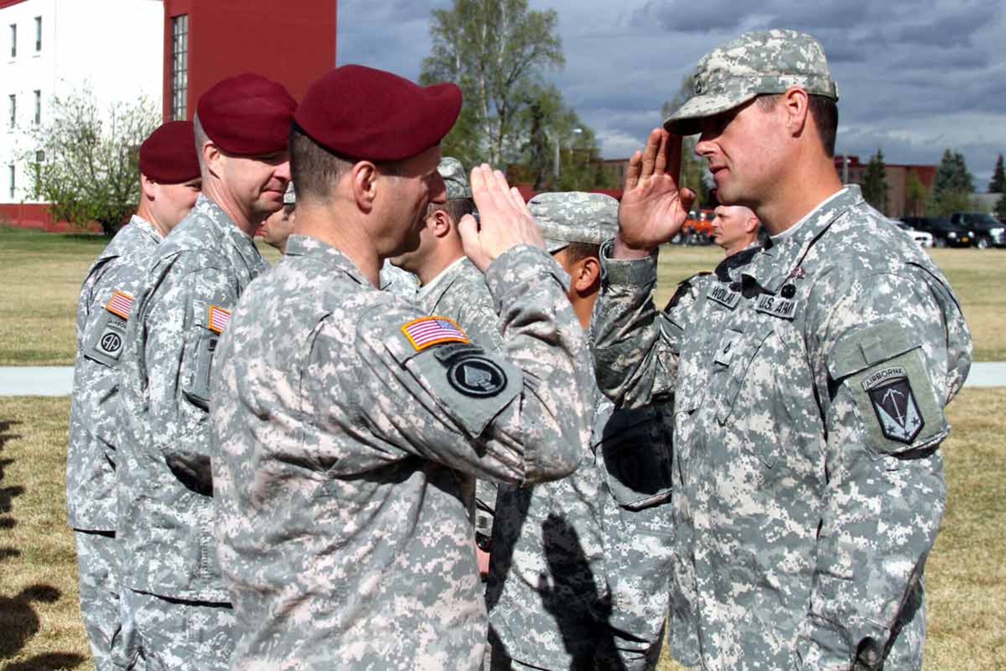 U.S. Army Alaska Commanding General Maj. Gen. Raymond Palumbo presents the Expert Field Medical Badge to Pfc. Jason Woolard May 20 on Joint Base Elmendorf-Richardson’s Pershing Field.  (U.S. Army photo/Staff Sgt. Jason Epperson)