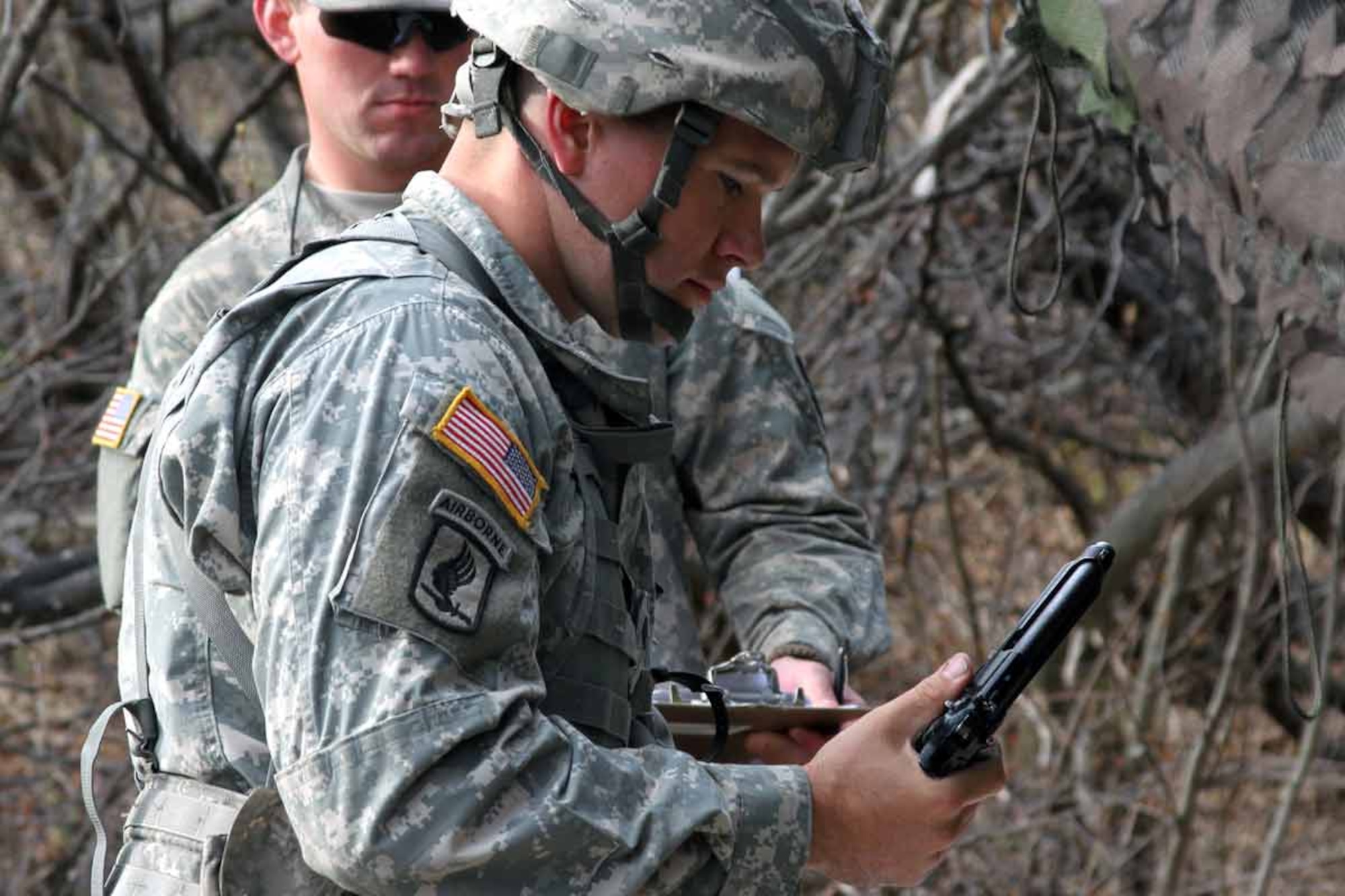 Spc. Theodore Batdorf disassembles a 9-mm pistol in the combat training lane to qualify for his Expert Field Medical Badge, May 17, at Joint Base Elmendorf-Richardson. (U.S. Army photo/Staff Sgt. Jason Epperson)