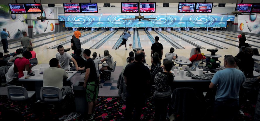 Members of Team Barksdale enjoy a friendly competition of bowling during Sports Day at the 16-lane bowling center on Barksdale Air force Base, La., May 25. Sports Day was designed to improve teamwork and promote the Air Force's Fit-to-Fight mission. (U.S. Air Force Photo/Senior Airman La'Shanette V. Garrett) (RELEASED) 