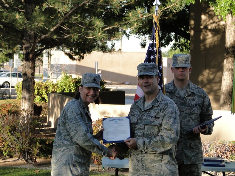 For outstanding achievement during her tenure as the commander of the 377th Medical Operations Squadron, Lt. Col. Dr. Stana Ilcus received the Air Force Achievement Medal from Col. Steven Reese, 377th Medical Group commander.