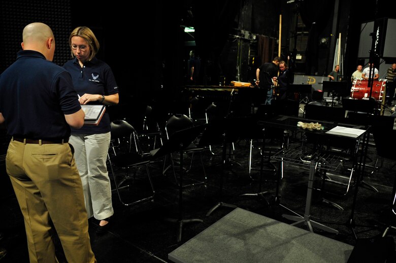 Maj. Matthew Henry and Staff Sgt. Rachel Trimble discuss last minute details before a performance of the United States Air Forces in Europe Band May 4, 2011, in Bratislava, Slovakia. The USAFE concert band is on tour through three countries, performing at seven locations as part of a building partnerships capacity and community outreach initiative. Major Henry is the commander and conductor of the USAFE Band. Sergeant Trimble is a vocalist and operations representative with the USAFE Band. (U.S. Air Force photo/Tech. Sgt. Jocelyn L. Rich)